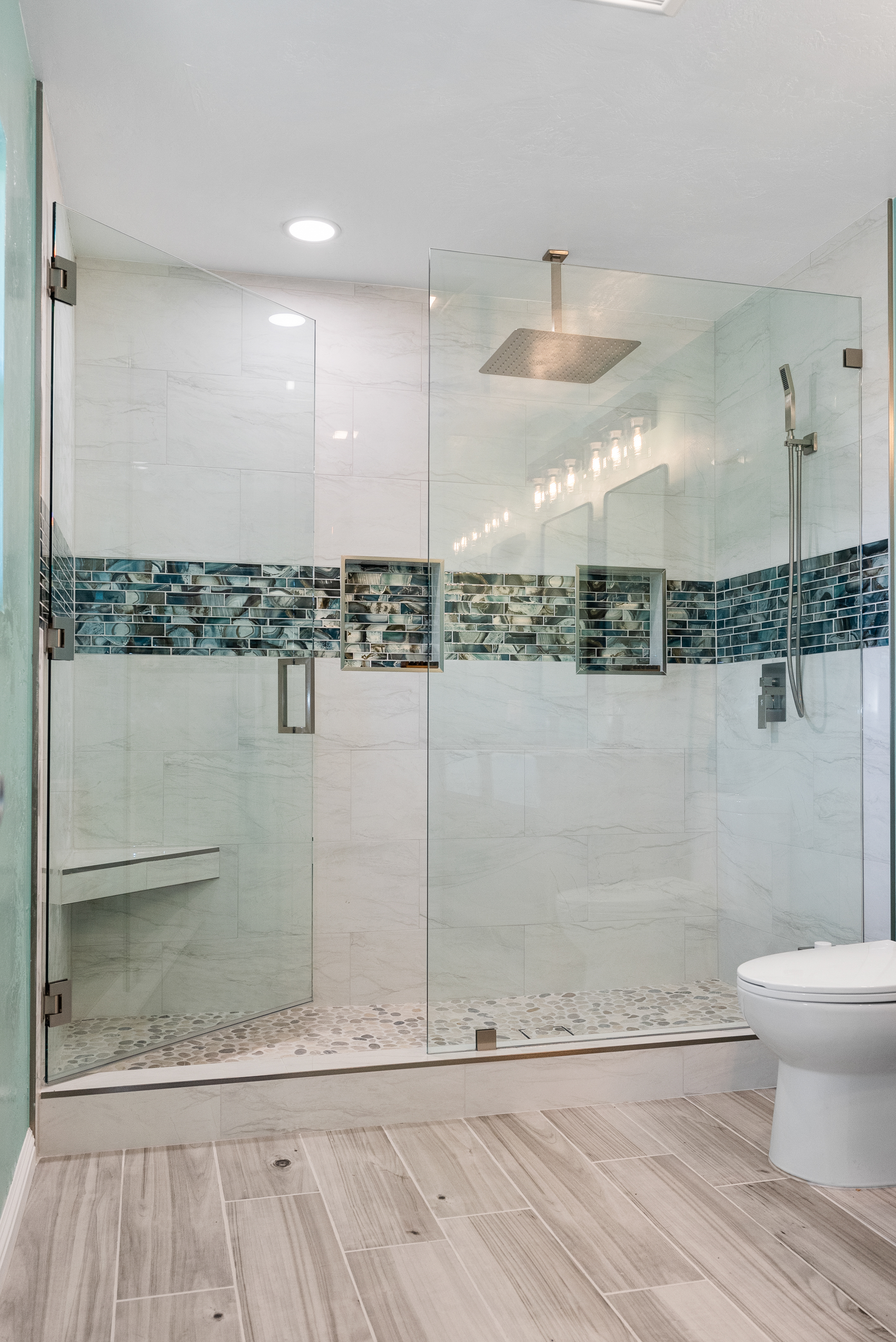 Custom-built shower with pebble-style tiles