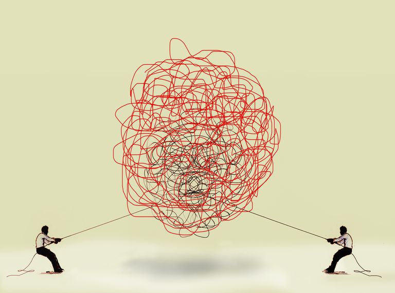 The complexity of educational reform symbolized by two figures engaging in a tug-of-war over tangled strings