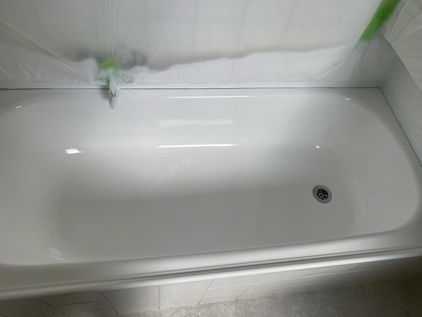 Recently resurfaced bathtub with smooth glossy finish