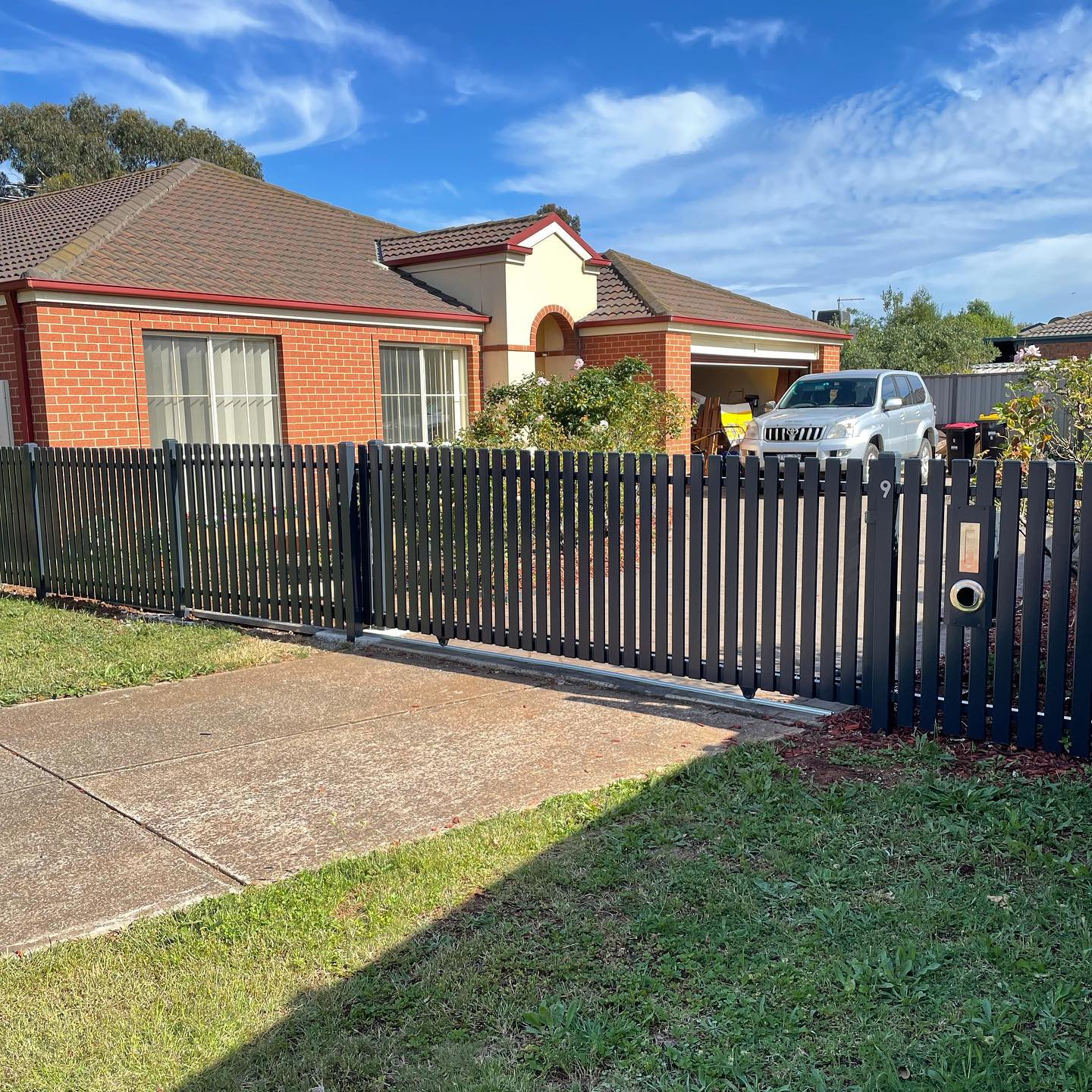 Charcoal Satin Steel Picket Fence in Melton South: A Client-Approved Success Story 4 Steel picket fence with integrated gate