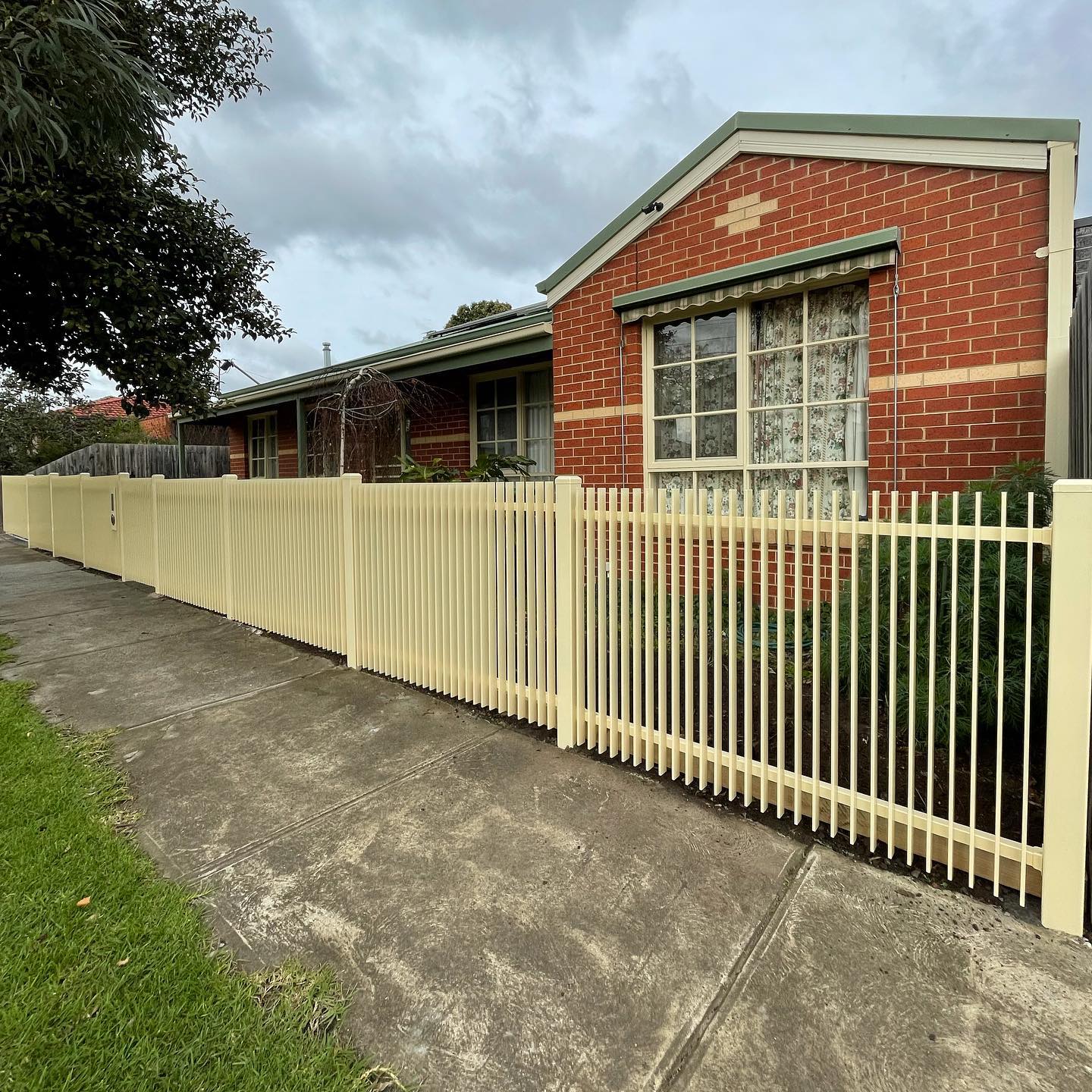 Revitalized Front Yard with Classic Cream Blade Style Fencing and Lockable Gates in Heidelberg Heights 3 Newly installed cream-colored blade style fence