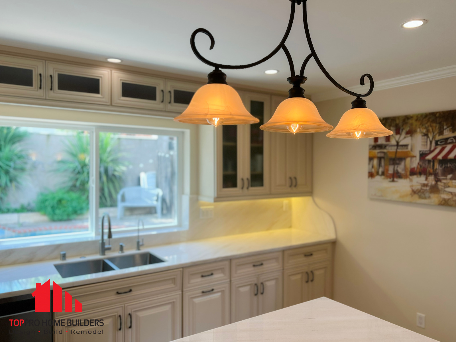 Modern kitchen featuring beige cabinetry