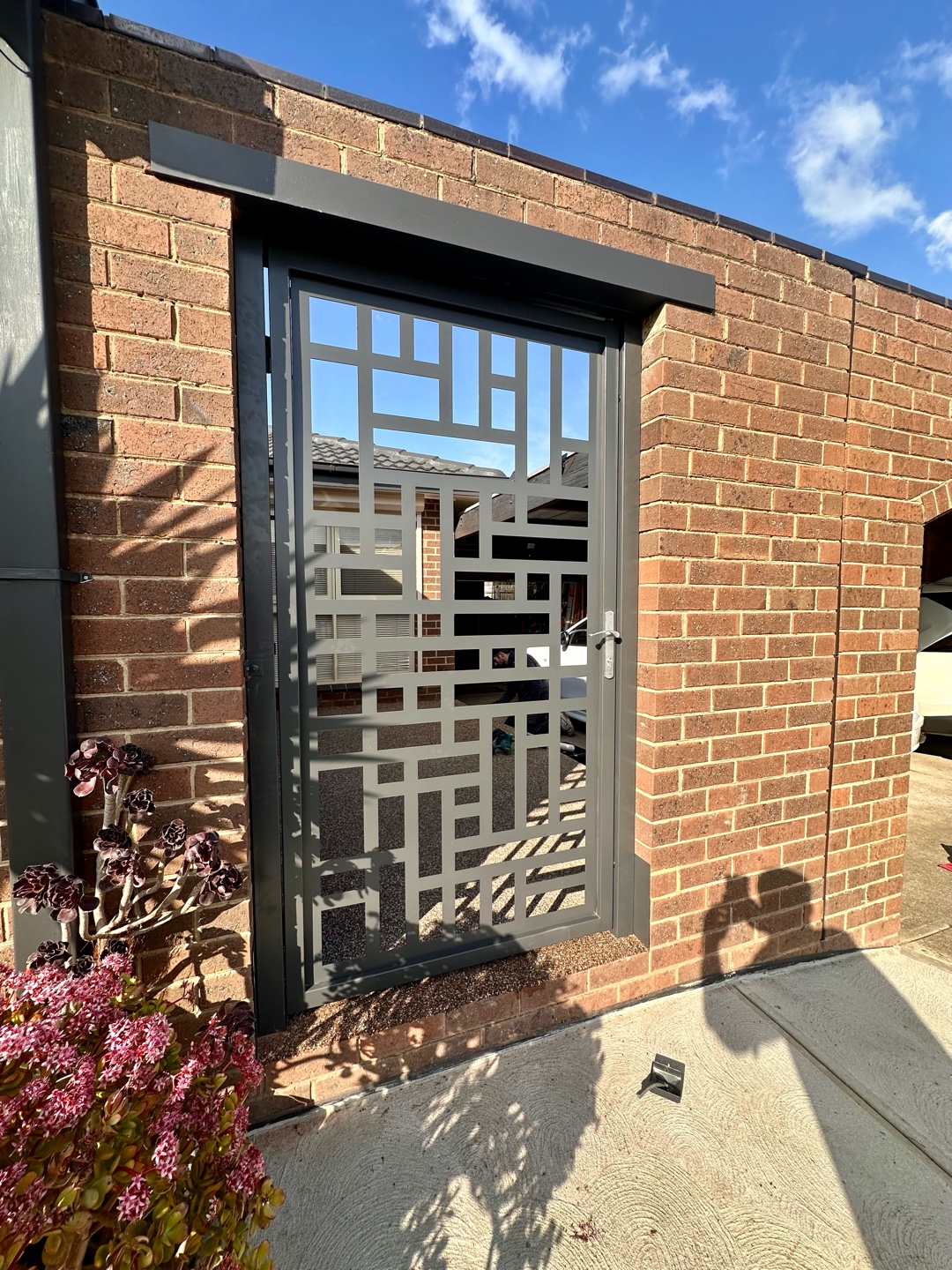 Custom steel door with geometric laser cut design