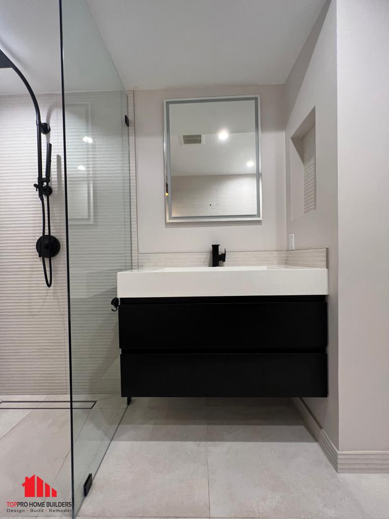 Modern bathroom interior featuring glass shower enclosure