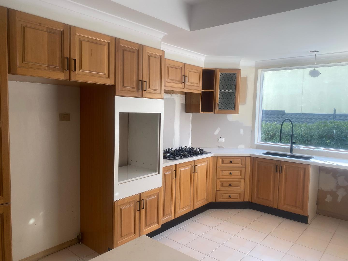 Wooden kitchen cabinets with natural wood finish