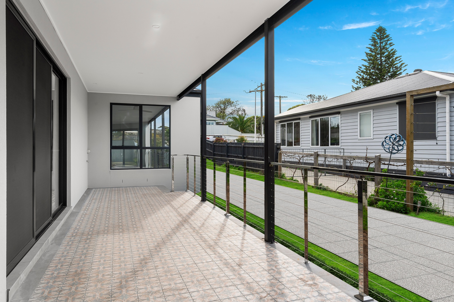 Modern outdoor patio area with tiled flooring