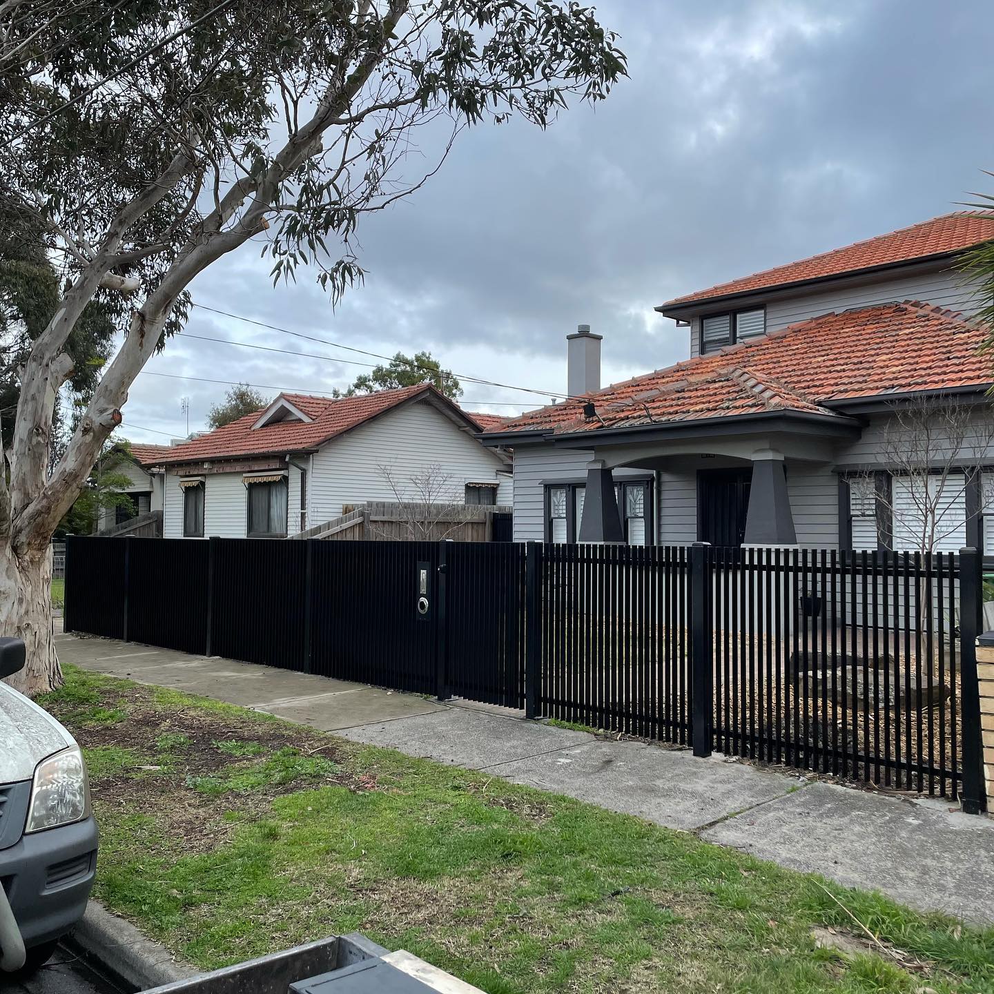Stunning Satin Black Blade Style Fence with Chrome Accessories in Northcote 5 Residential area with newly installed blade style fence