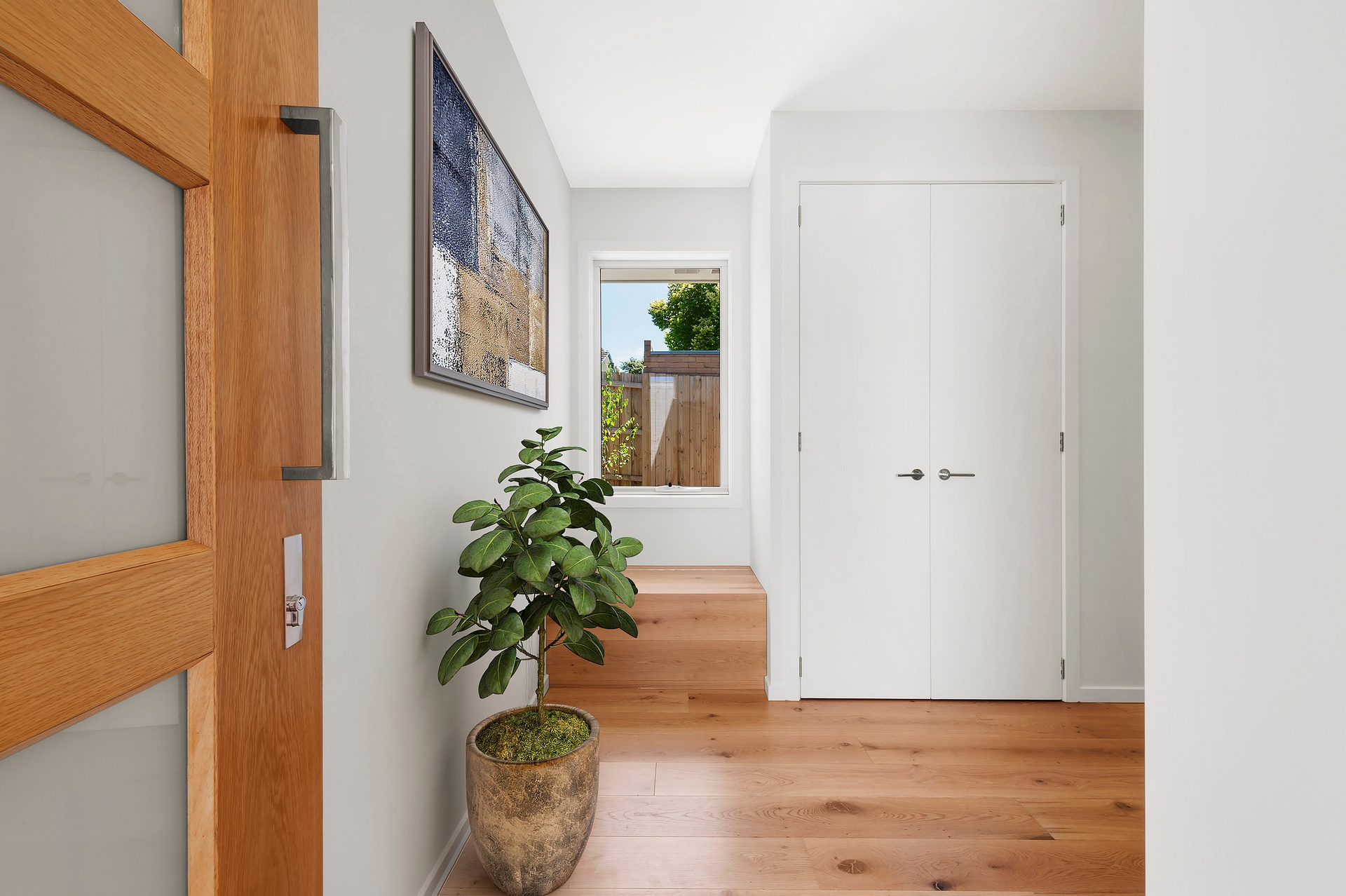 Bright hallway with wooden flooring