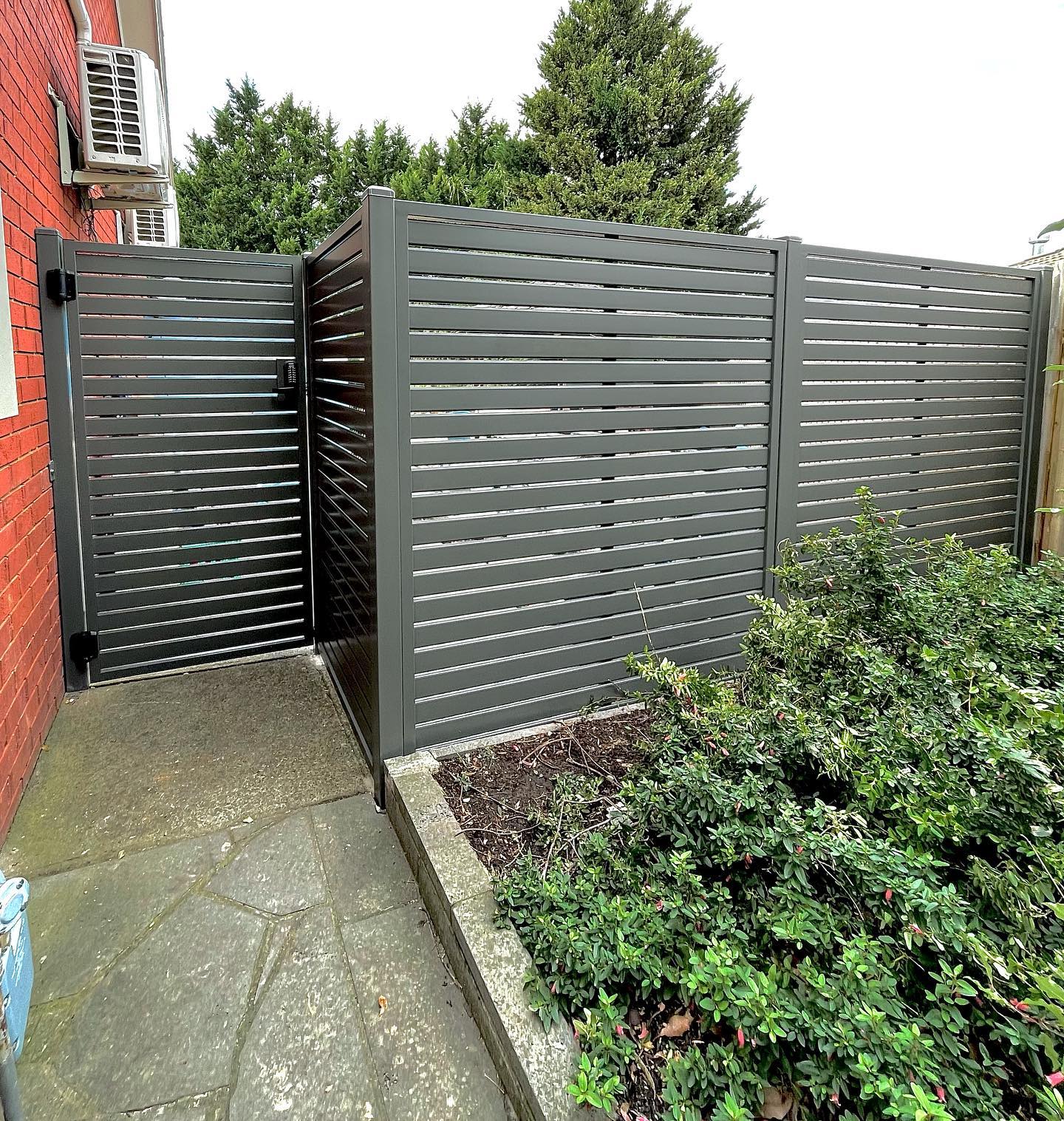 Eltham Steel Fencing: Security and Privacy with Style 2 Horizontal slats in picture-framed panels forming a fence