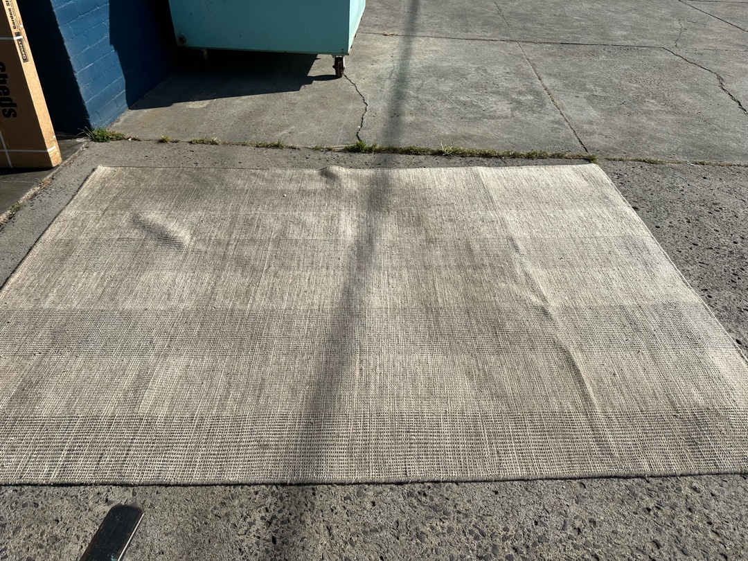 Flat wave woollen rug before cleaning