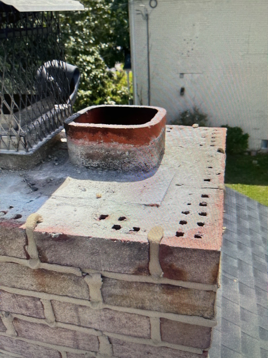 Detailed view of red brick chimney cap