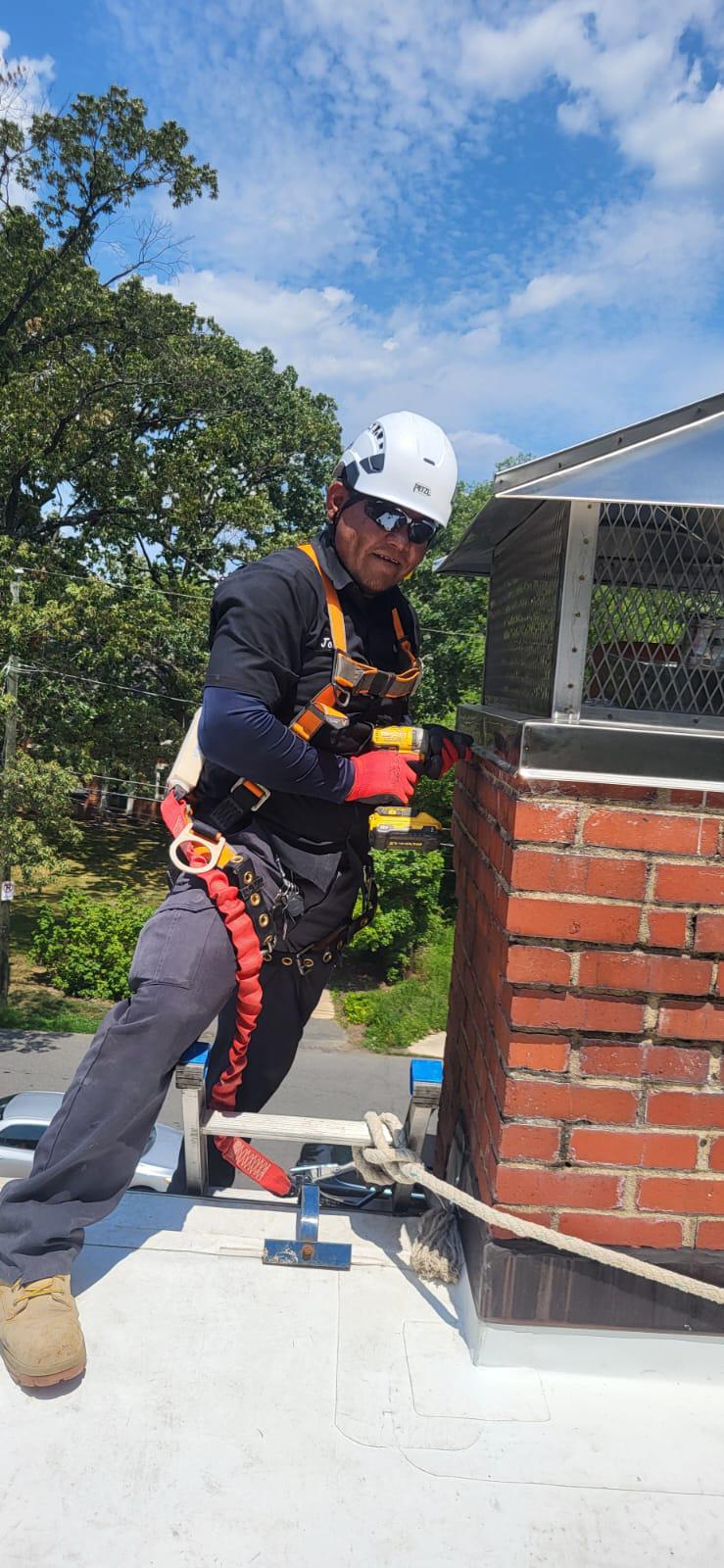 Technician using power drill to secure mount cap