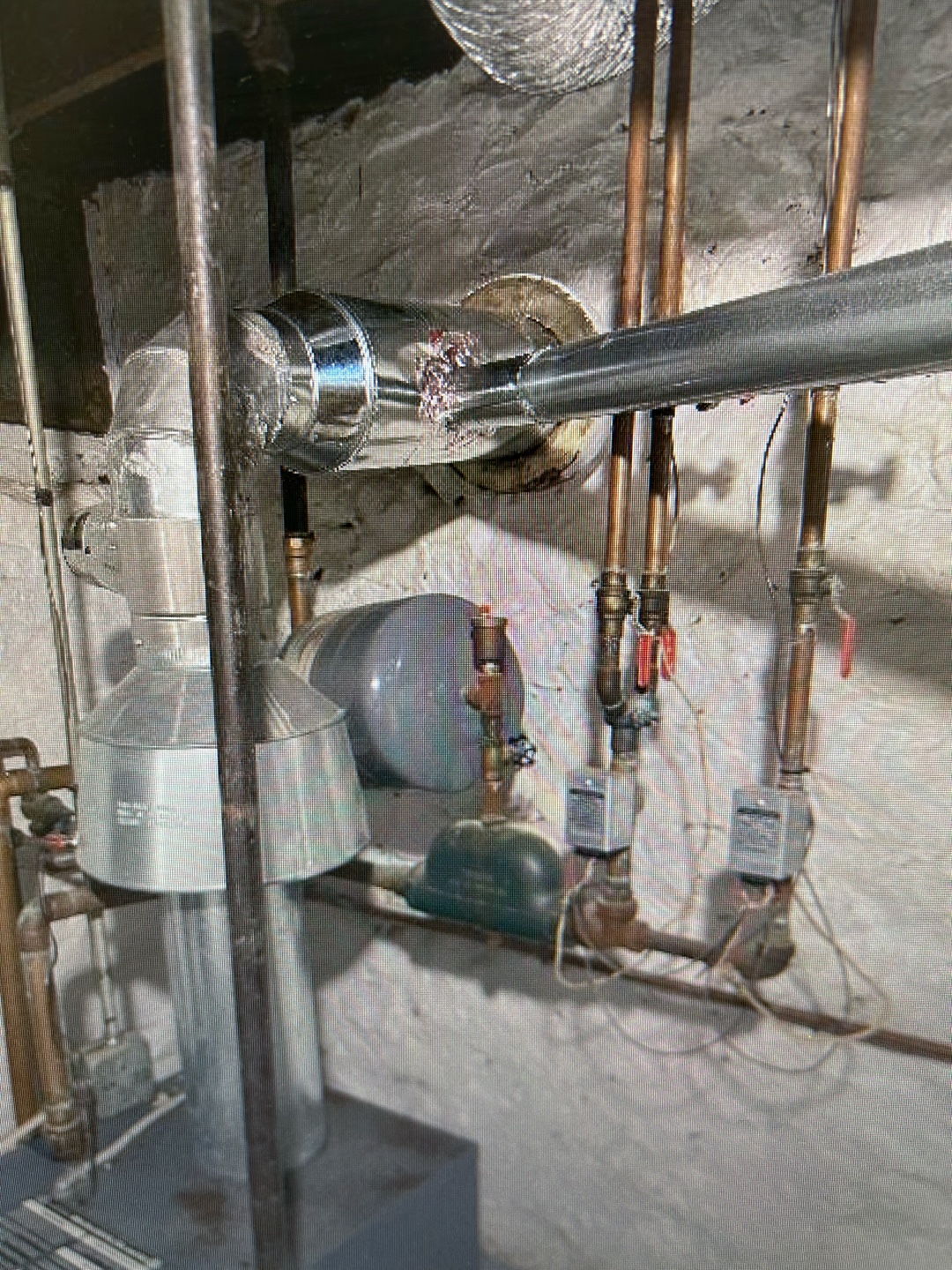 Metal ductwork with insulation wrapping visible