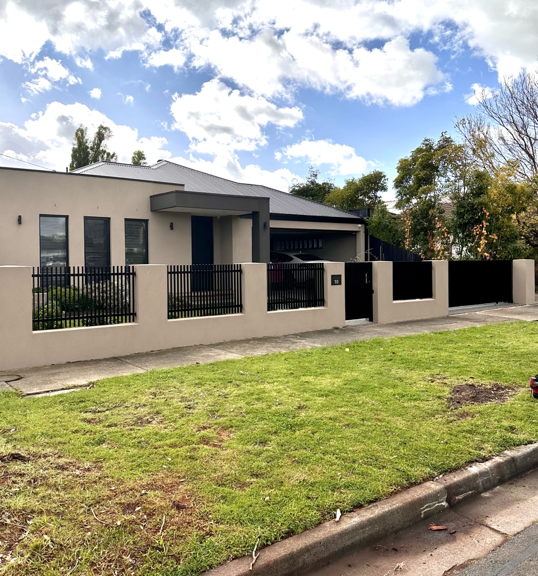 Blade Style Infills and Sliding Gate Installation in Reservoir 2 Modern residential house with blade-style infill fence