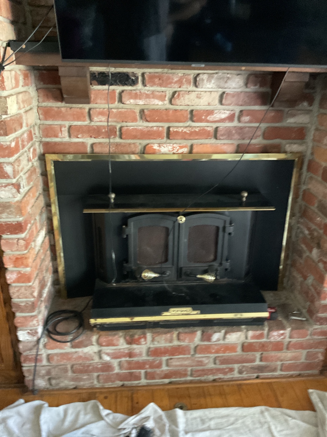 Repair work being done on brick fireplace