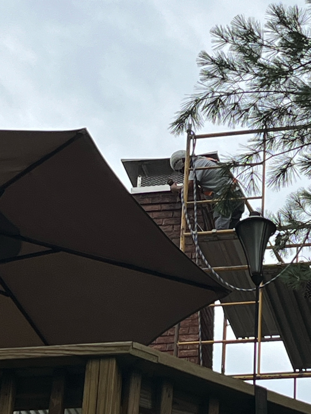 Worker finishing mount cap installation