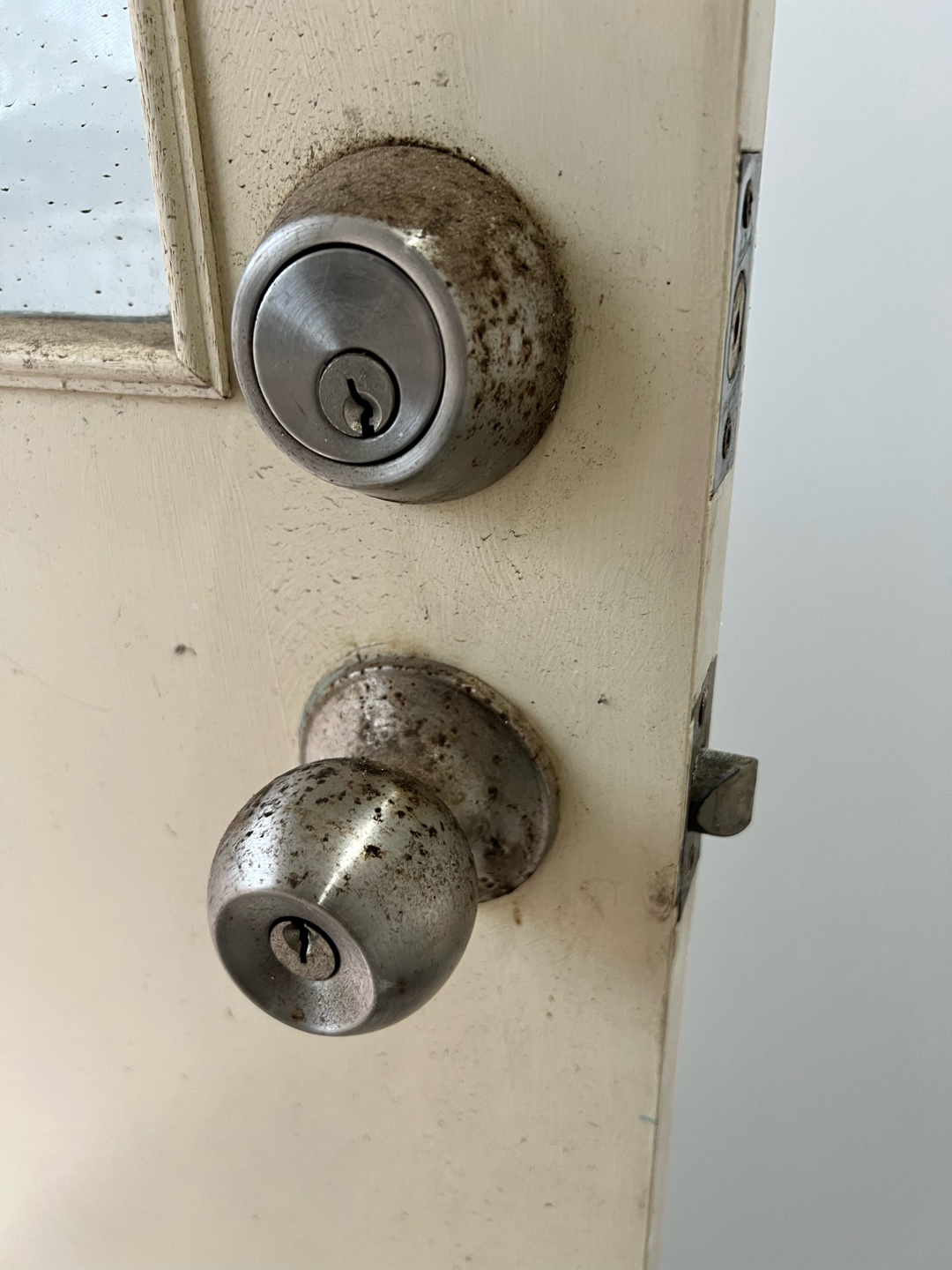 Old and rusted door locks indicating wear and tear