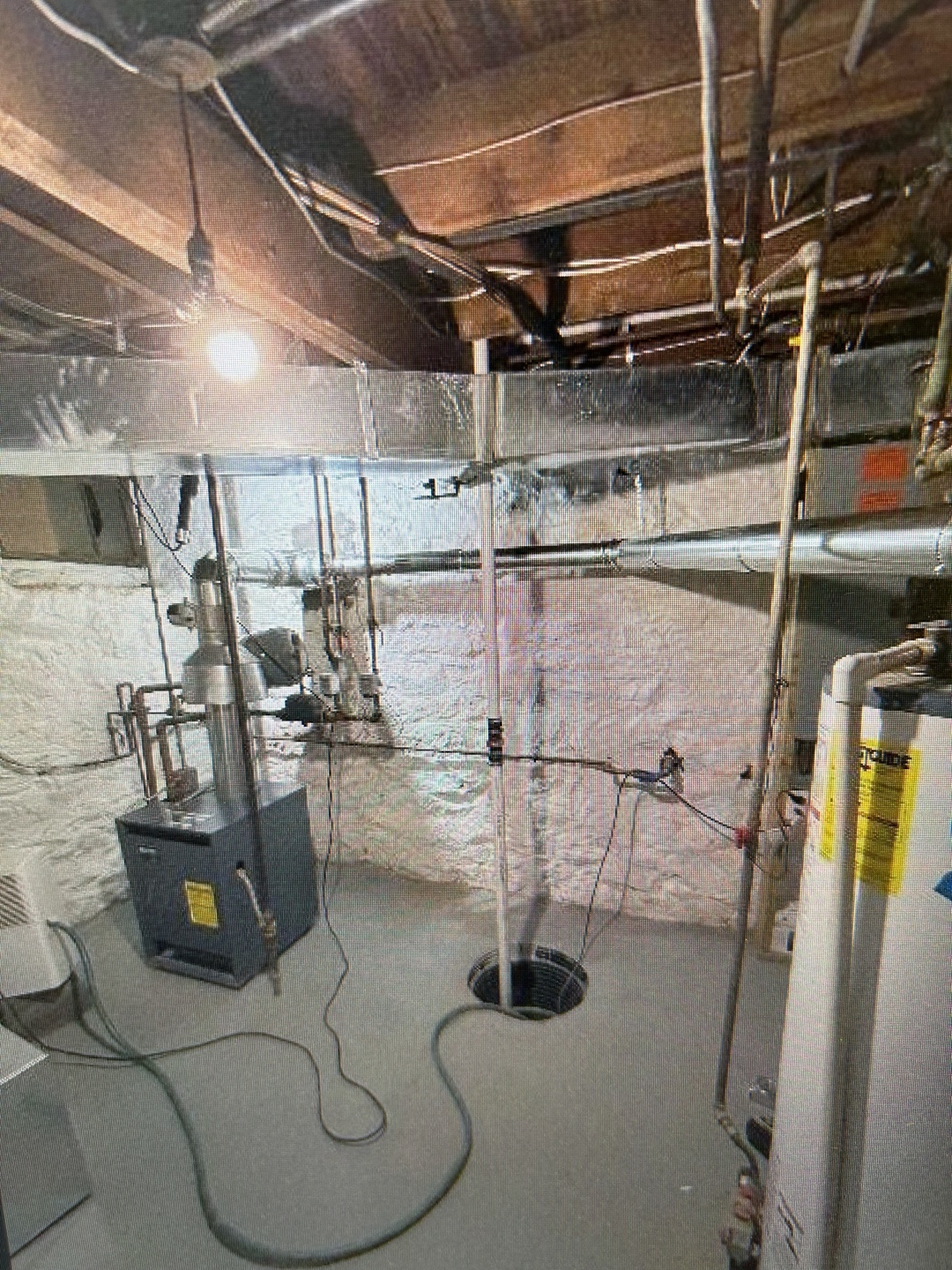 Unfinished basement with exposed ceiling beams
