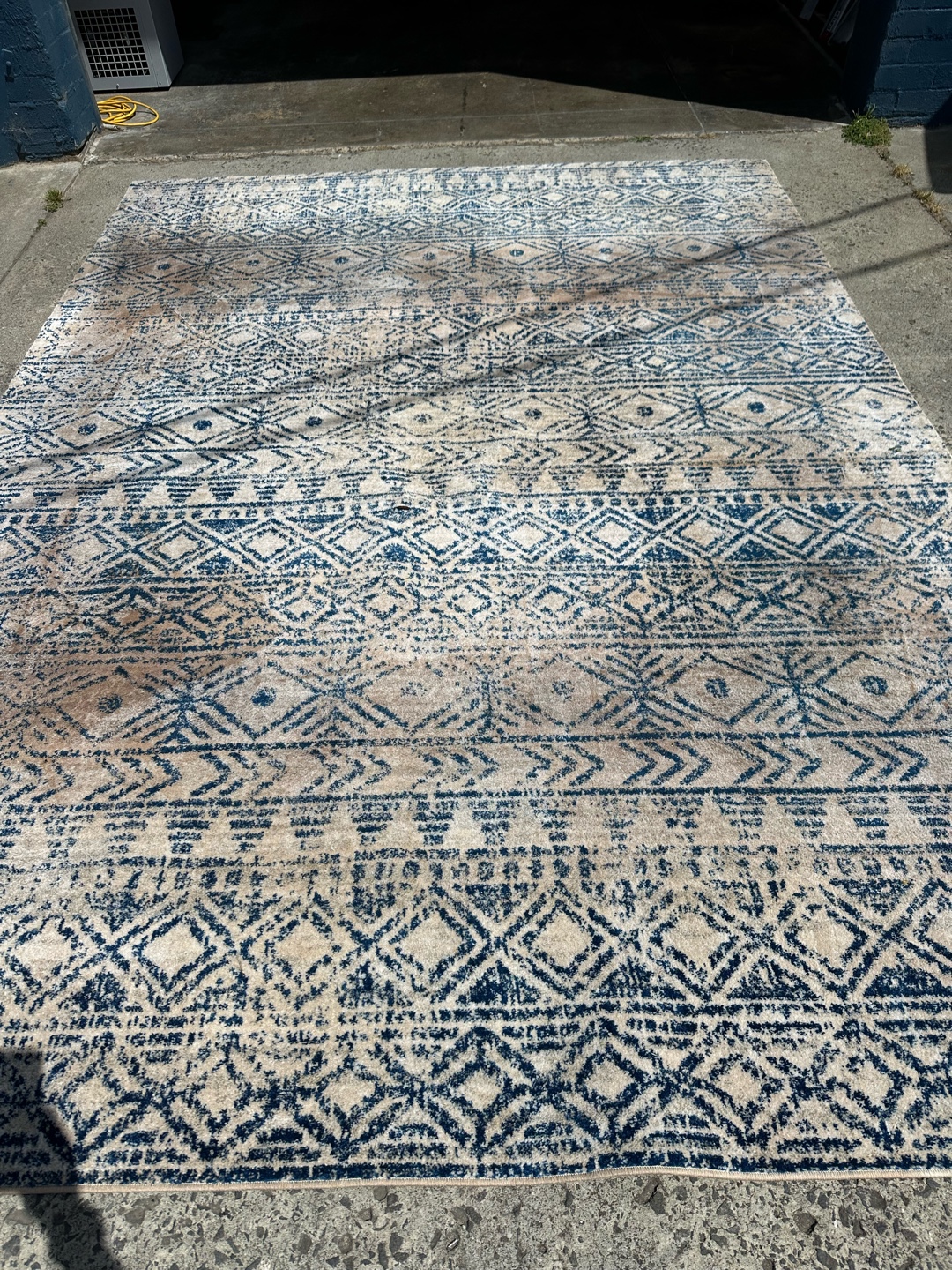 Flat wave rug outdoors after cleaning