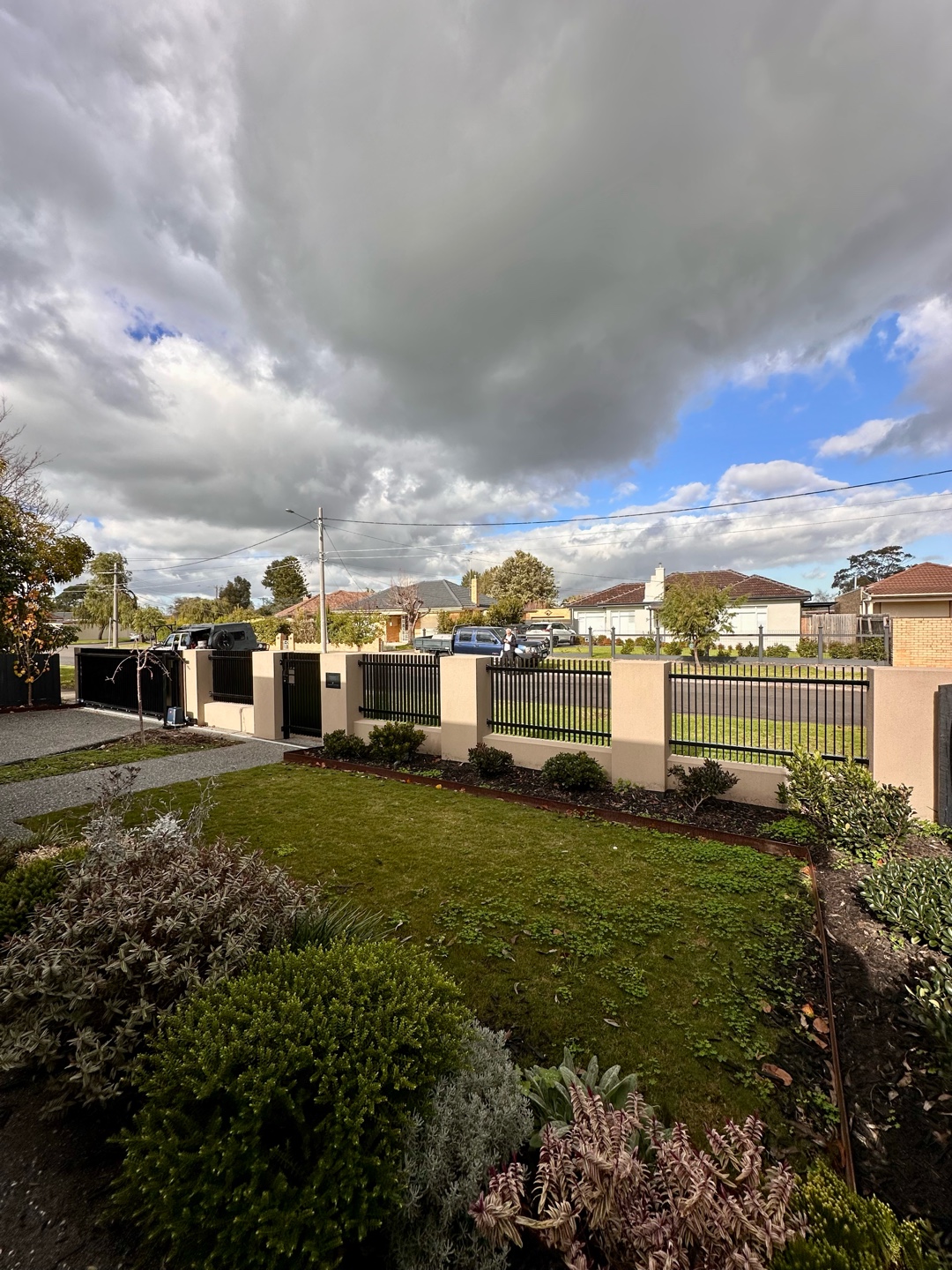 Blade Style Infills and Sliding Gate Installation in Reservoir 5 Well-maintained garden with sliding gate