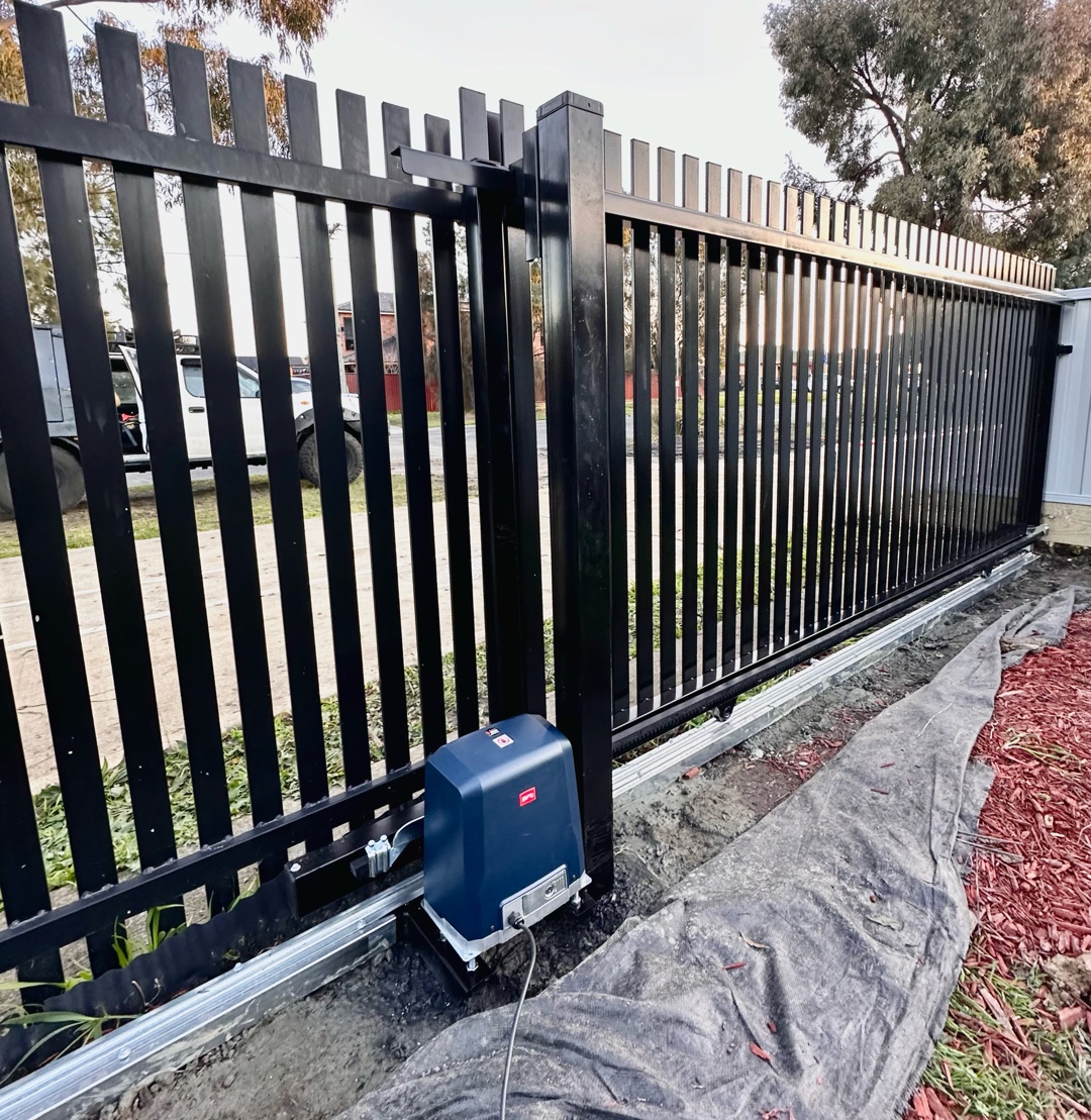 Automated gate motor attached near the base of the gate