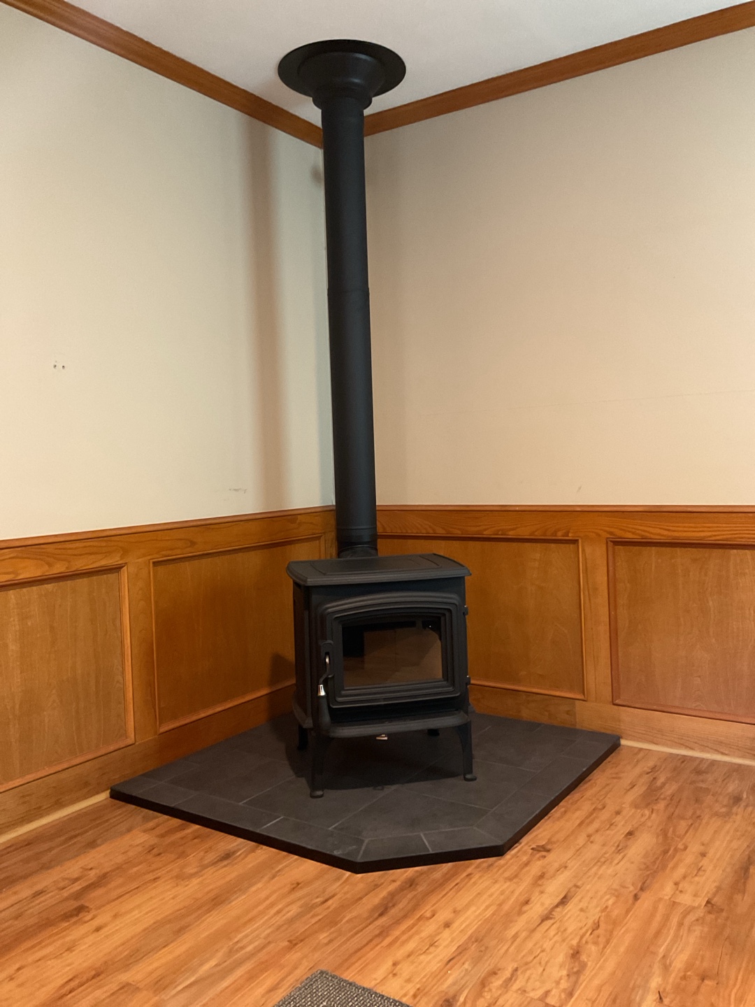 Black Jotul stove installed in a cozy living room