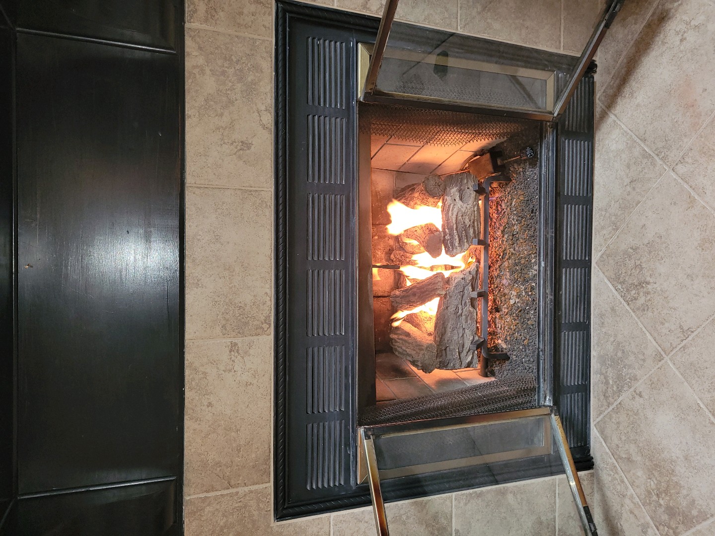 Lit gas fireplace during inspection