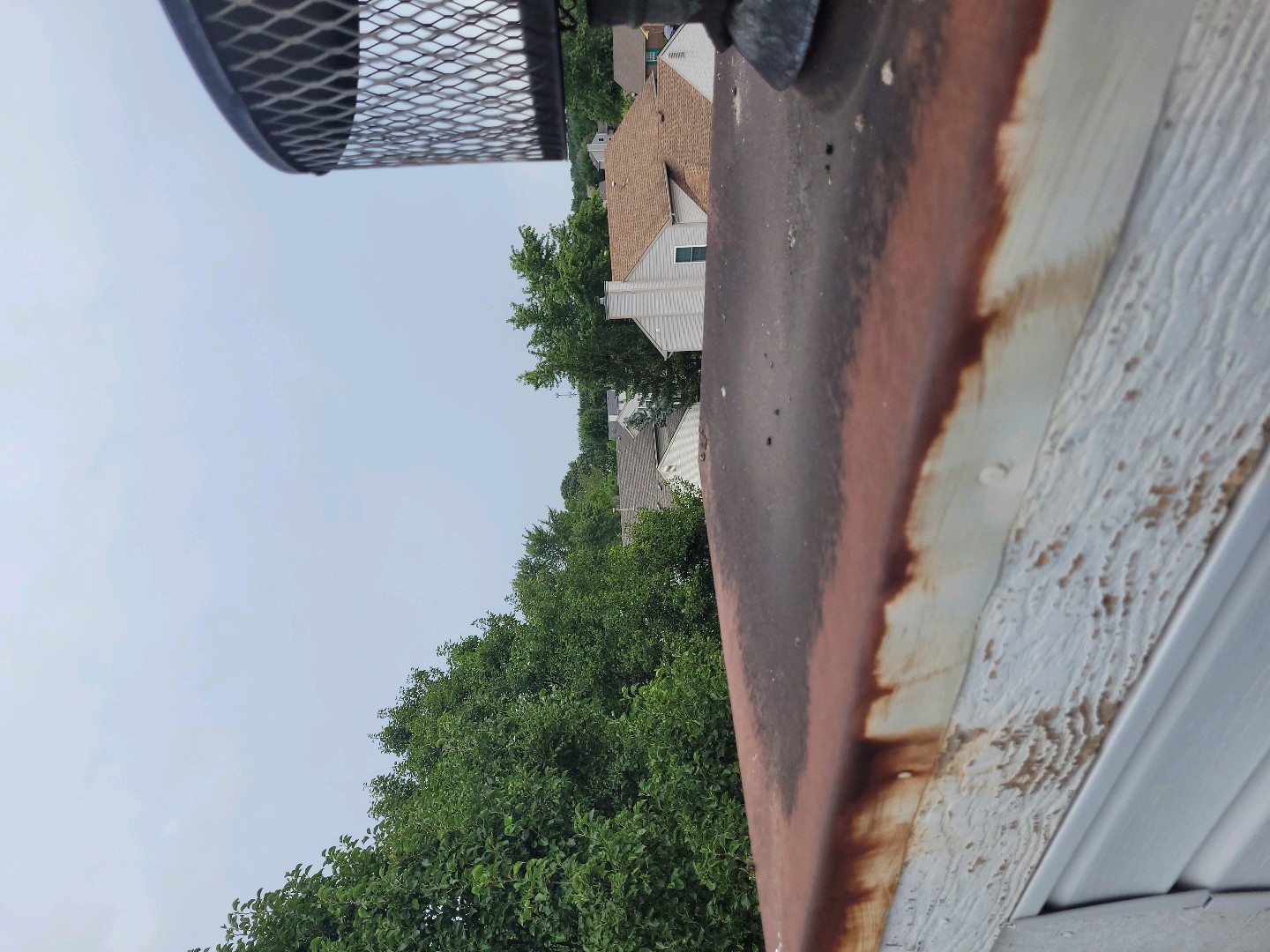 Rusted chimney cap before replacement