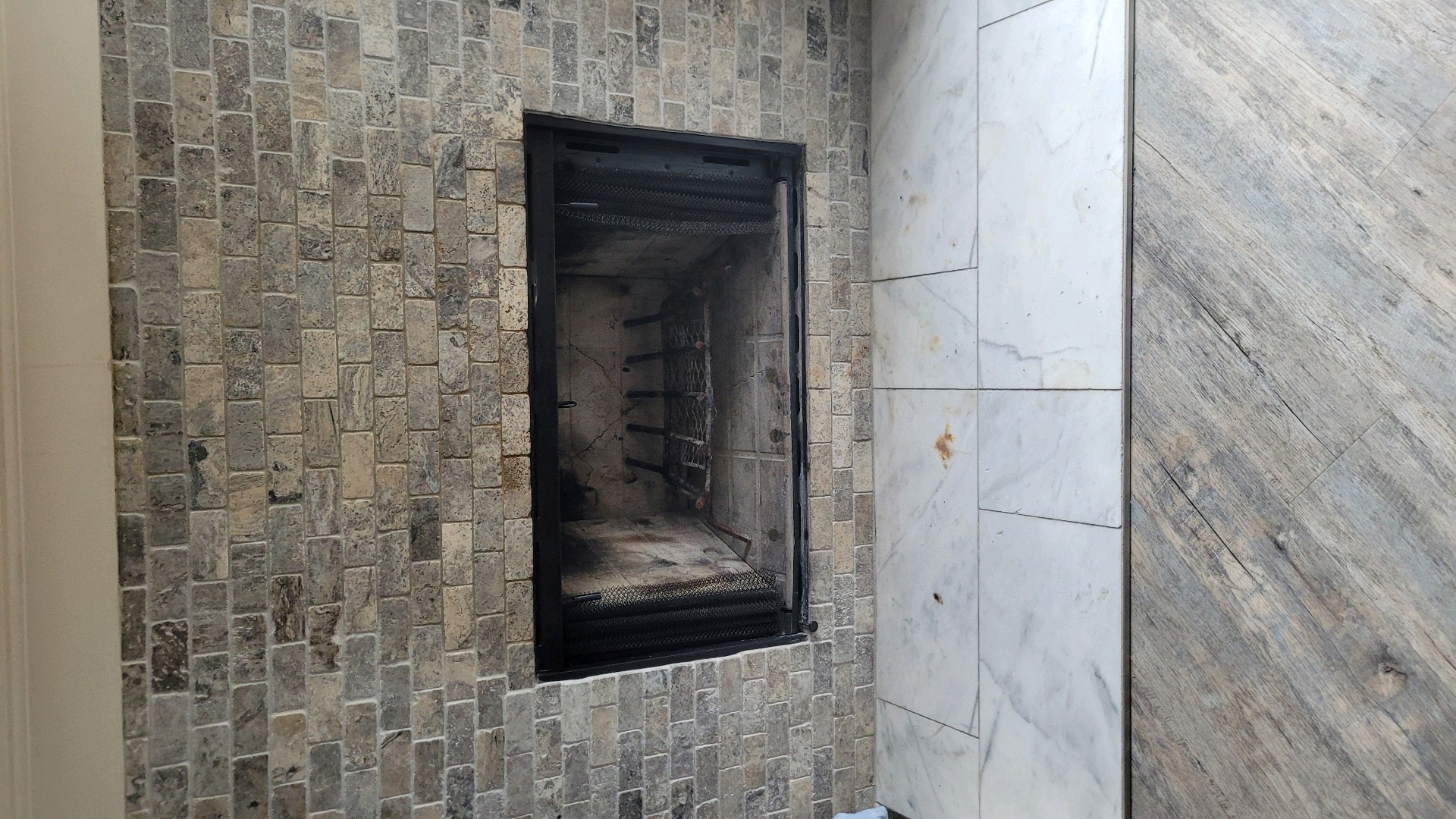 Restored fireplace with brick surround