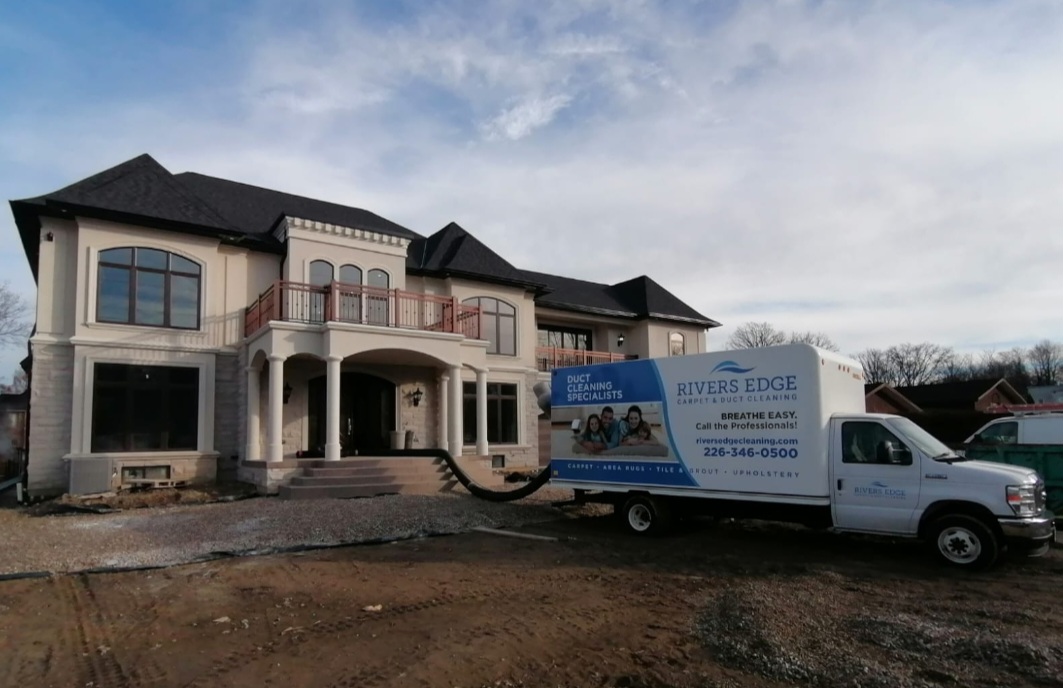 Rivers Edge Carpet & Duct Cleaning truck parked in front of Belle River home