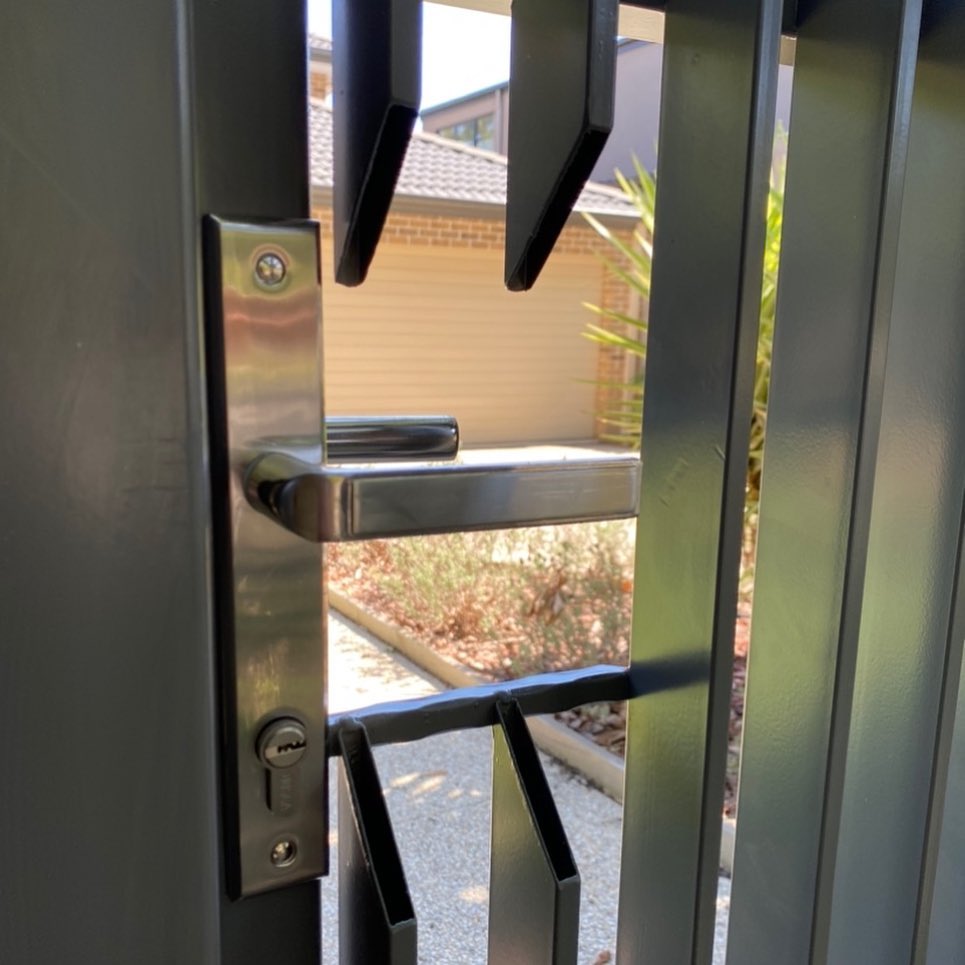 Close-up view of metallic gate with vertical bars