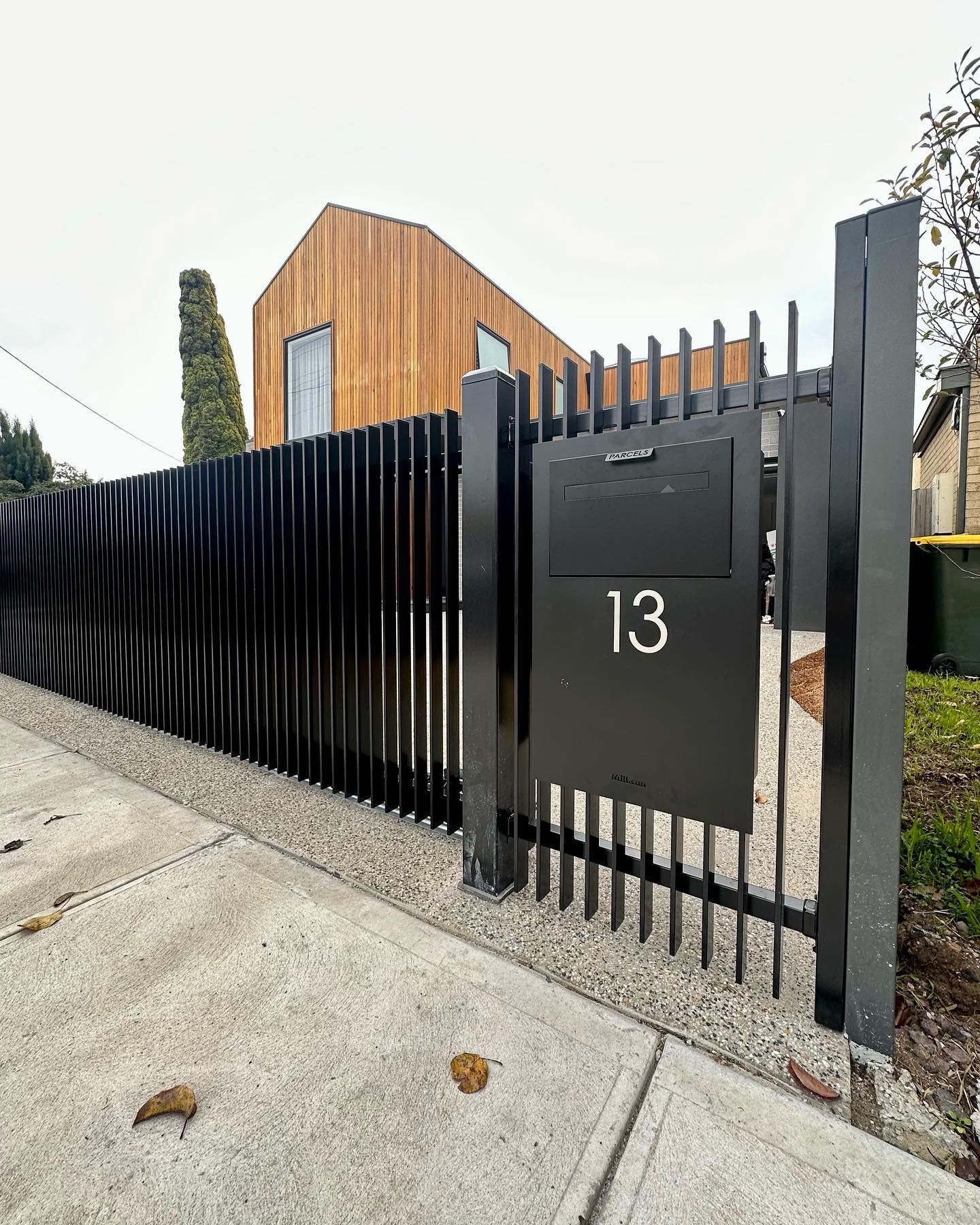 Satin Black Blade Style Fence Installation in Altona North 4 Pedestrian gate featuring a parcel box