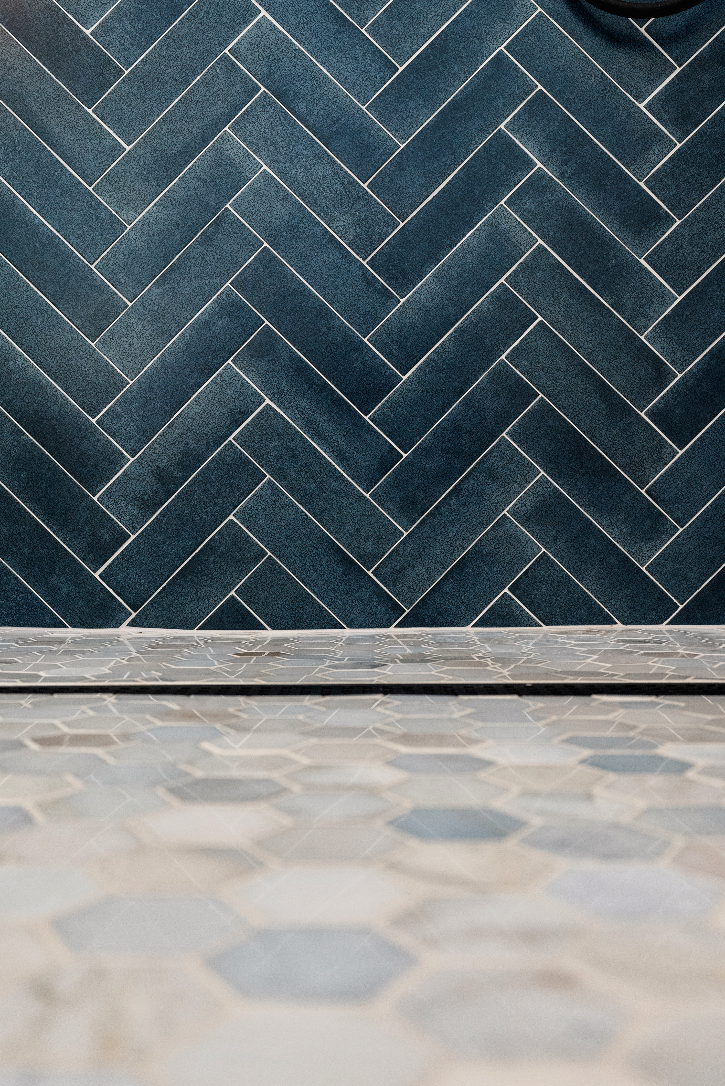 Dark blue herringbone pattern tiles