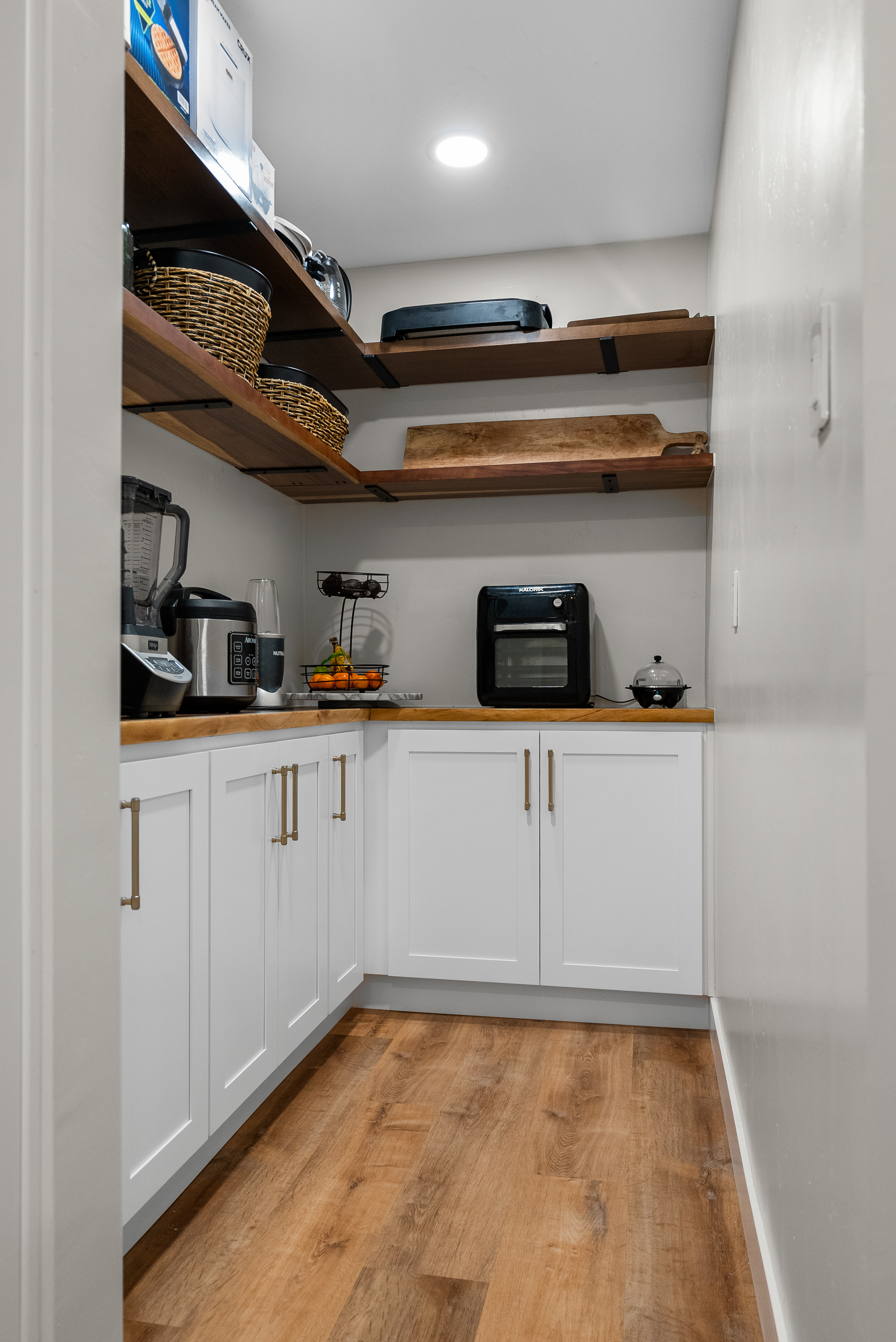 Wooden floating shelves in modern kitchen