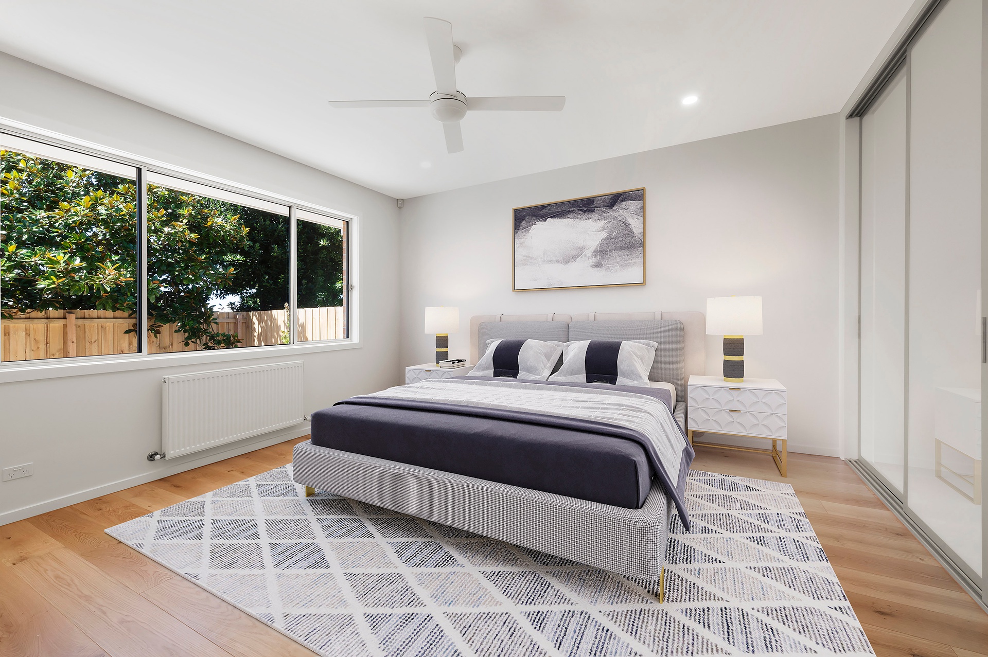 Well-lit bedroom with large window