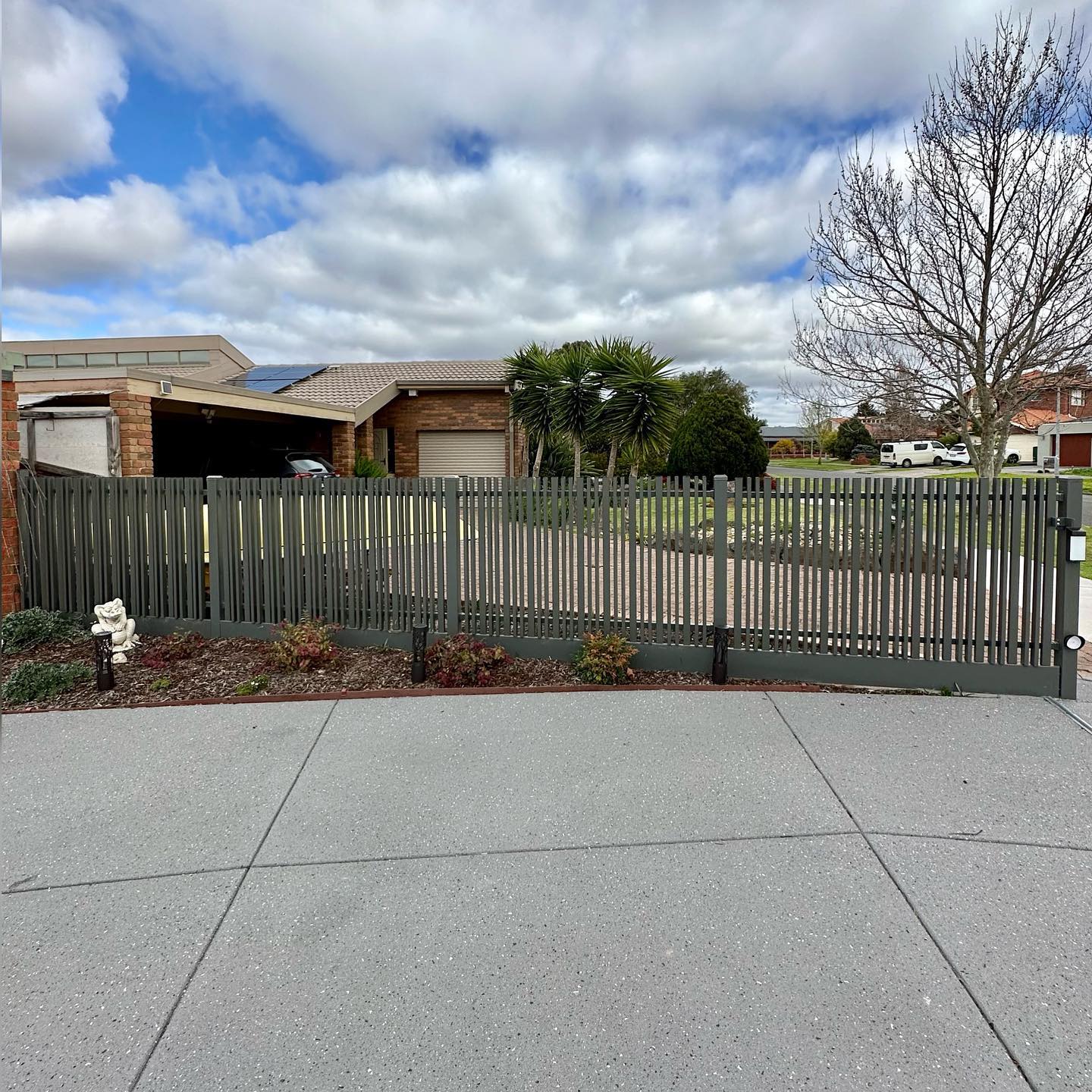 Residential property with slat blade fencing