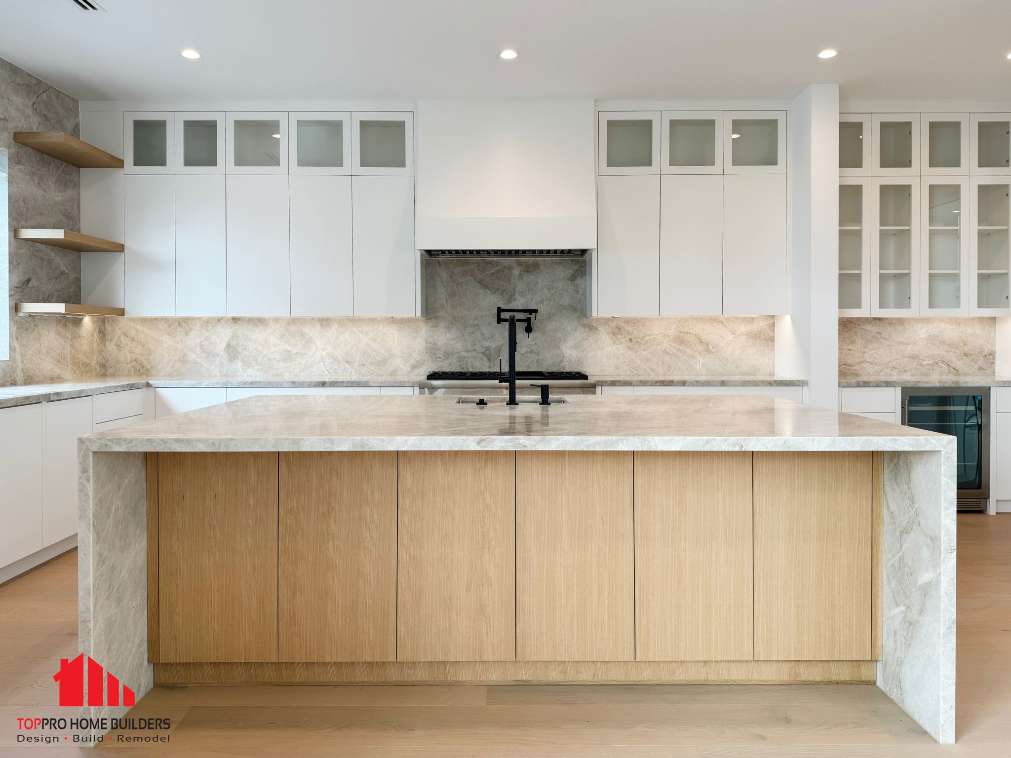 Large kitchen island with marble countertop during installation