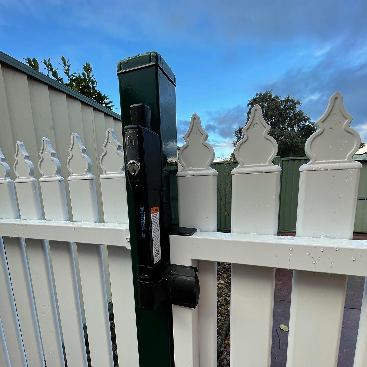 Metal picket fence gate latch mechanism