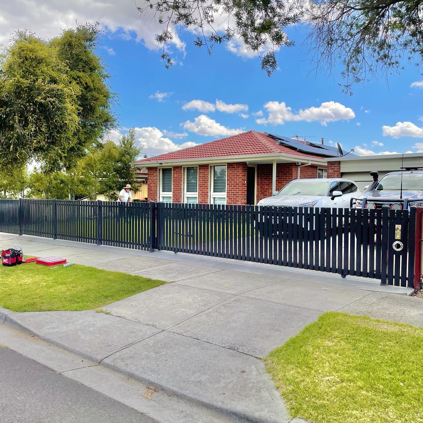Residential house with newly installed black metal fence