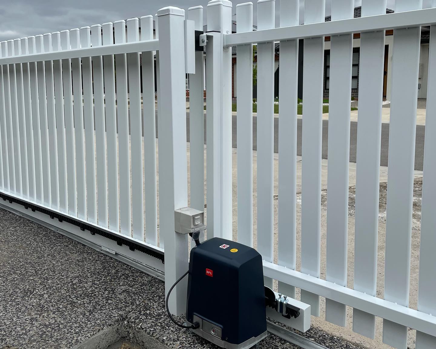 BFT electric motor attached to automatic sliding gate