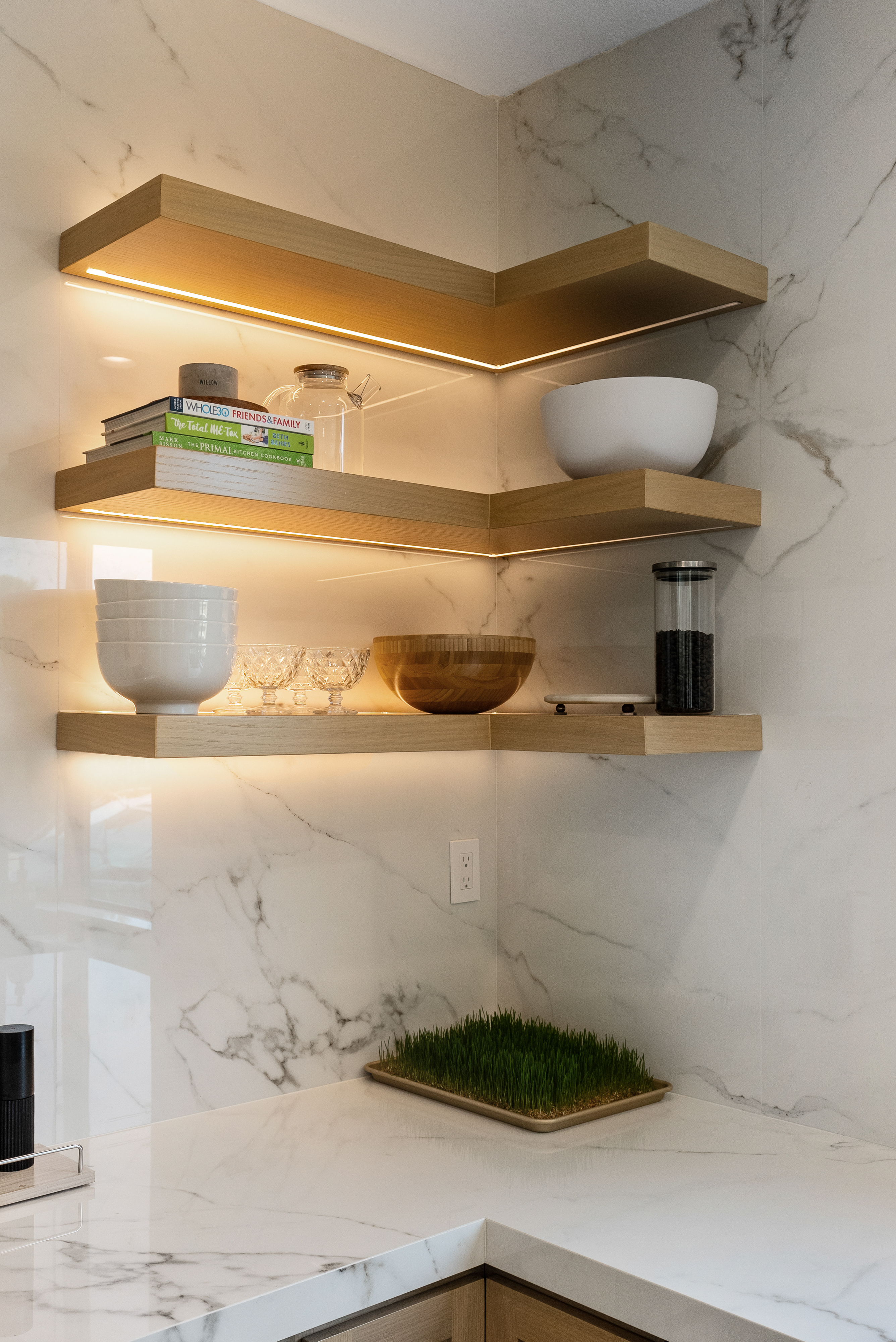 Floating shelves with integrated lighting showcasing decor