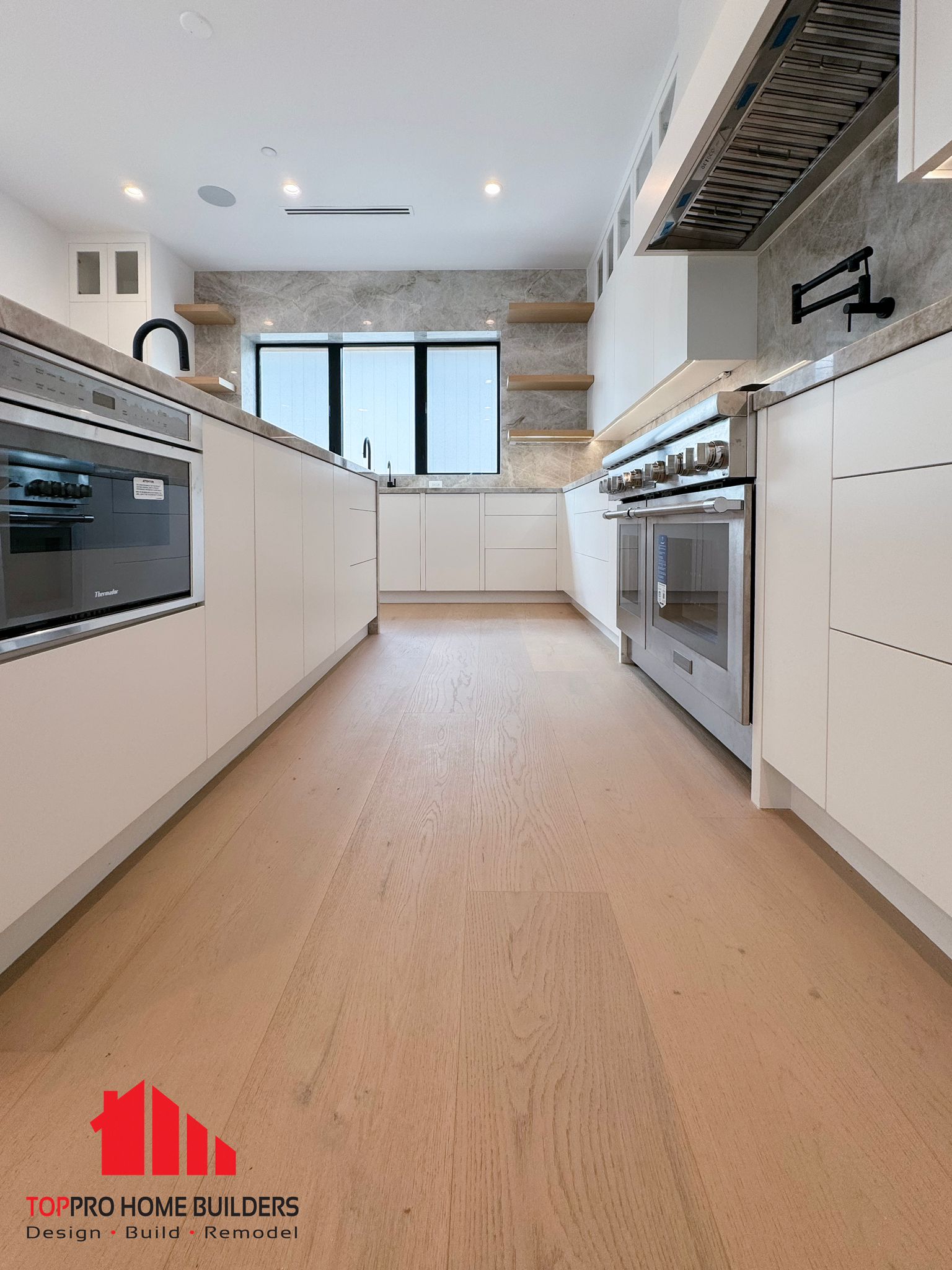 Final view of remodeled modern kitchen with sleek design