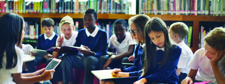 Children reading in a library
