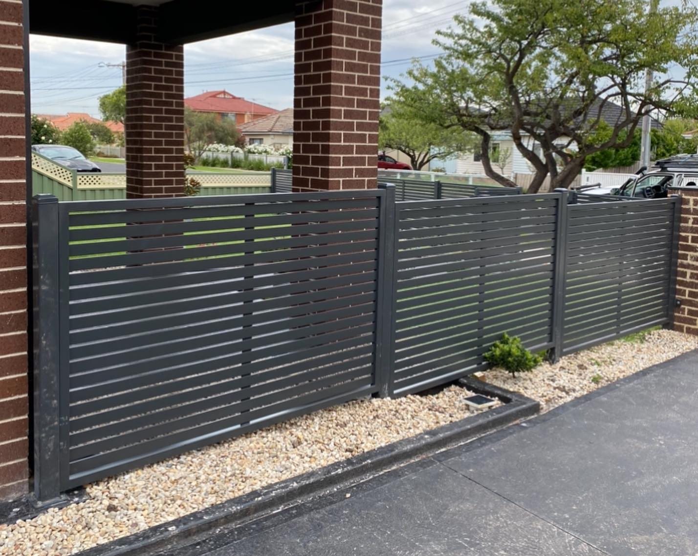 Monument Finished 50x10 Slat Screen Fence and Pedestrian Gate in Lalor 2 50x10 slat screen fence and pedestrian gate finished in monument