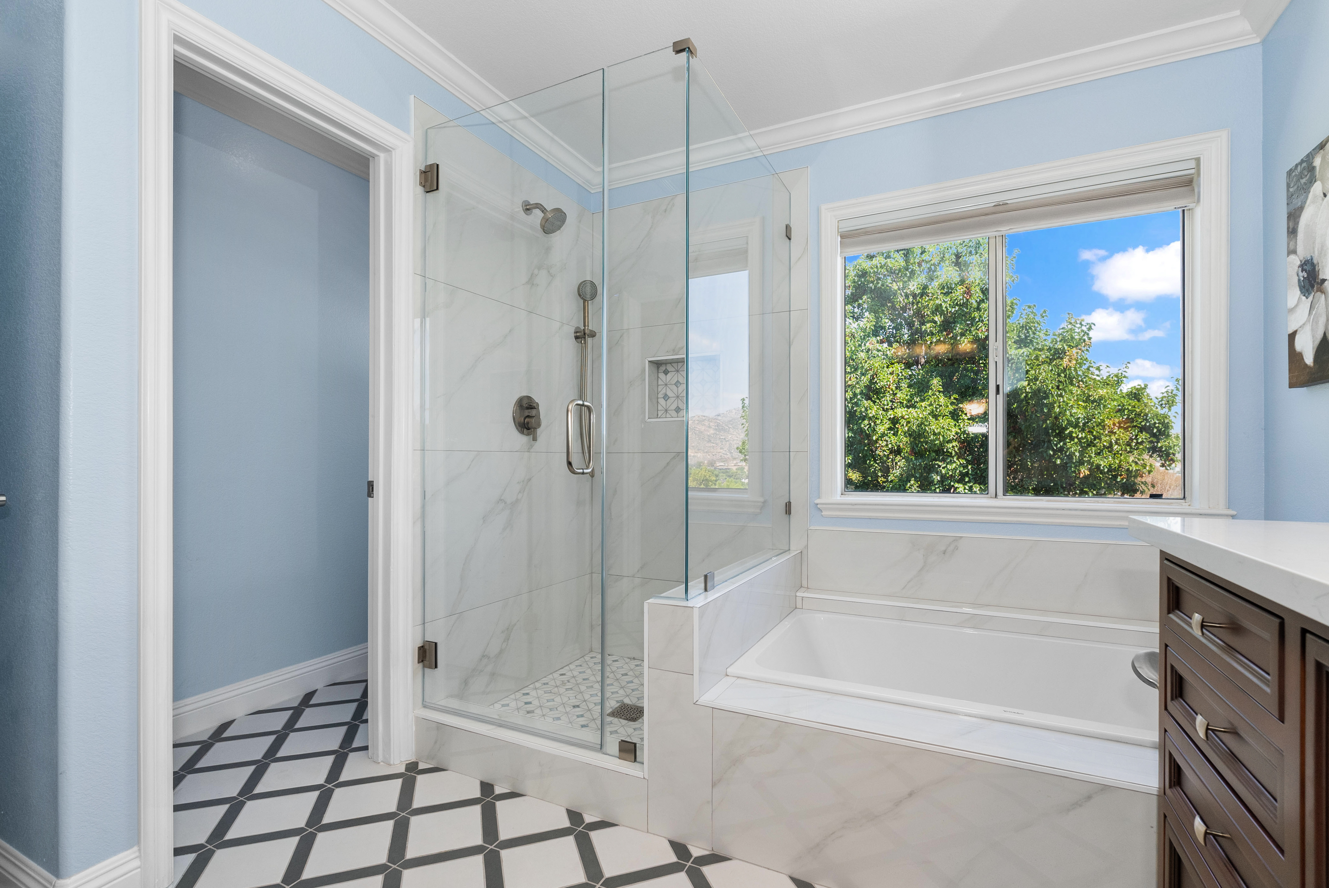 Modern bathroom showcasing glass-enclosed shower and elegant finishes