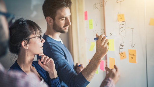 A team collaboratively addressing complex issues in an educational setting