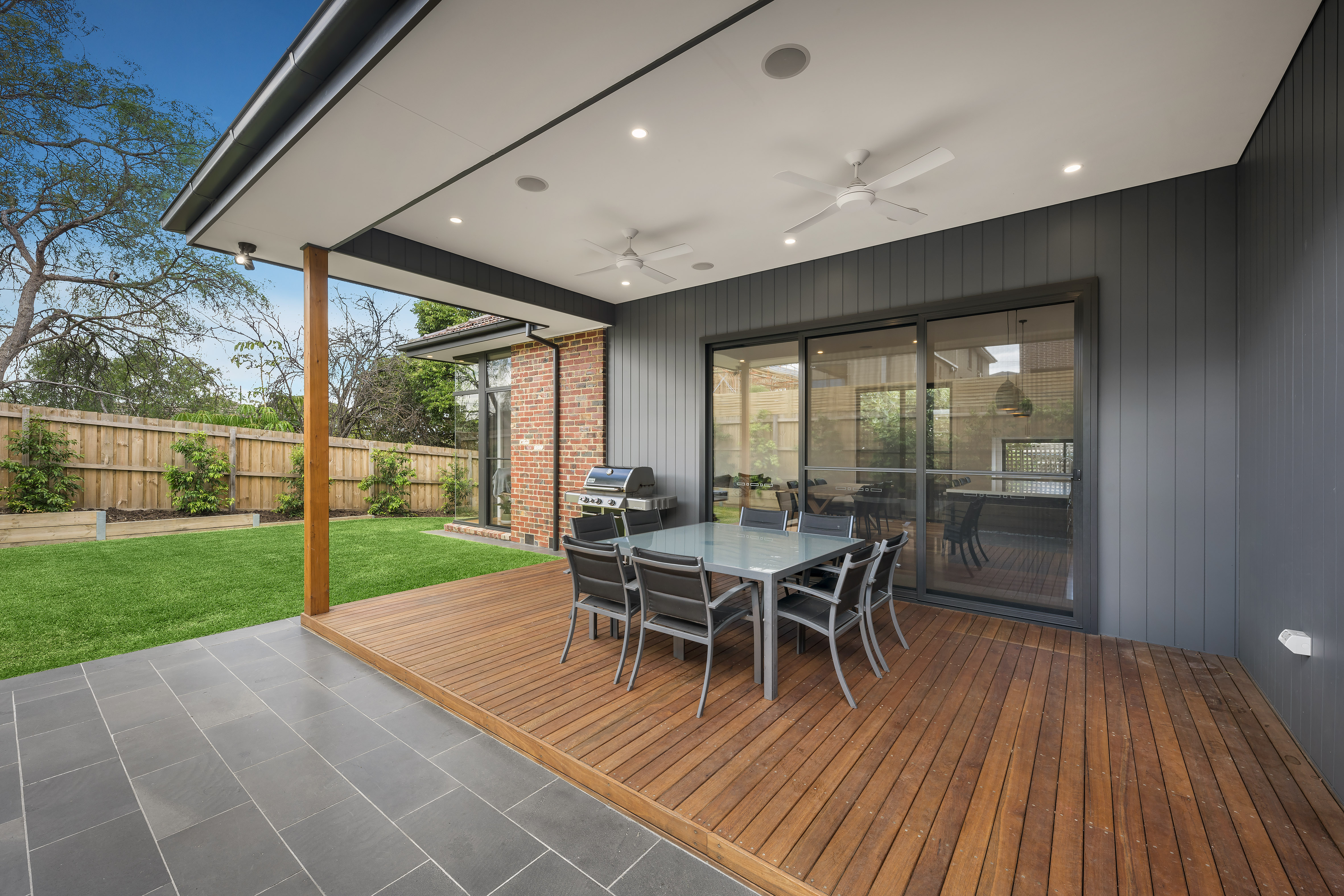Outdoor patio area with wooden deck