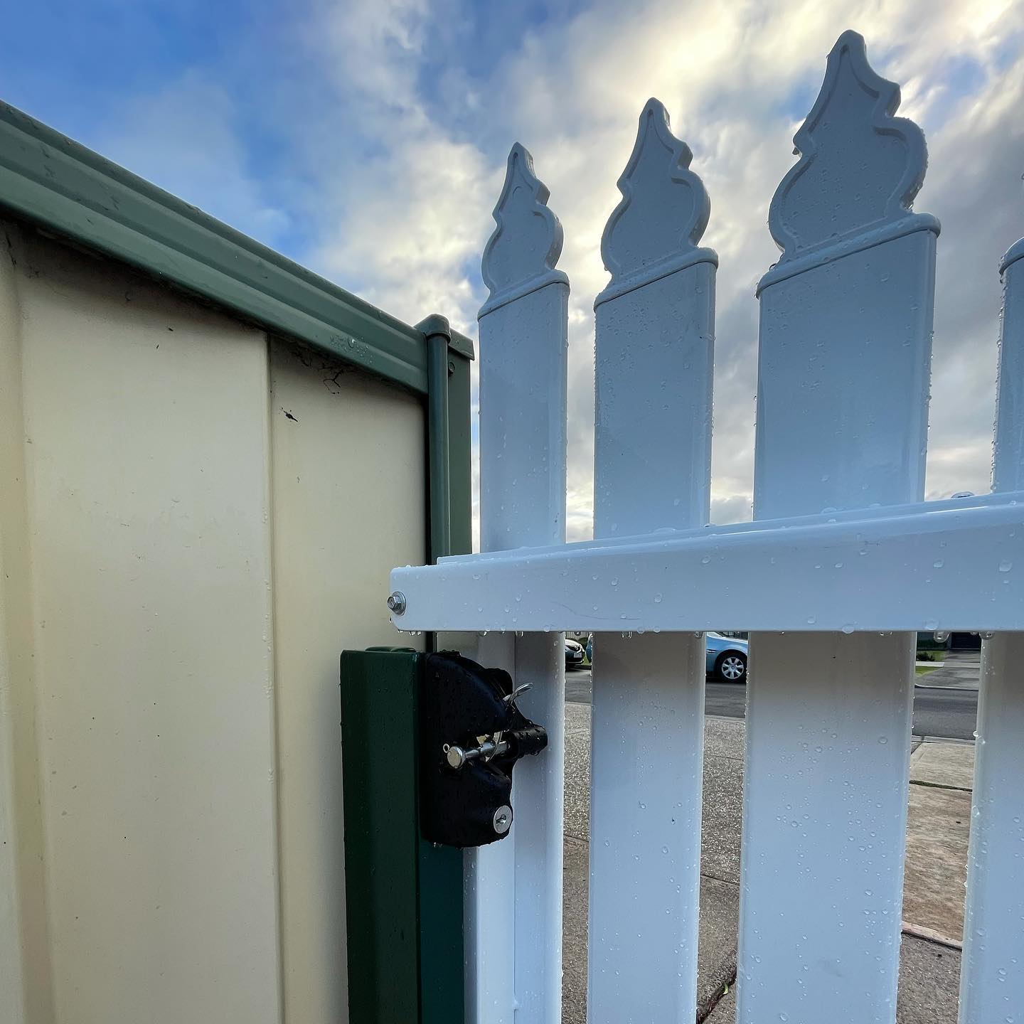 White metal picket fence hinge mechanism