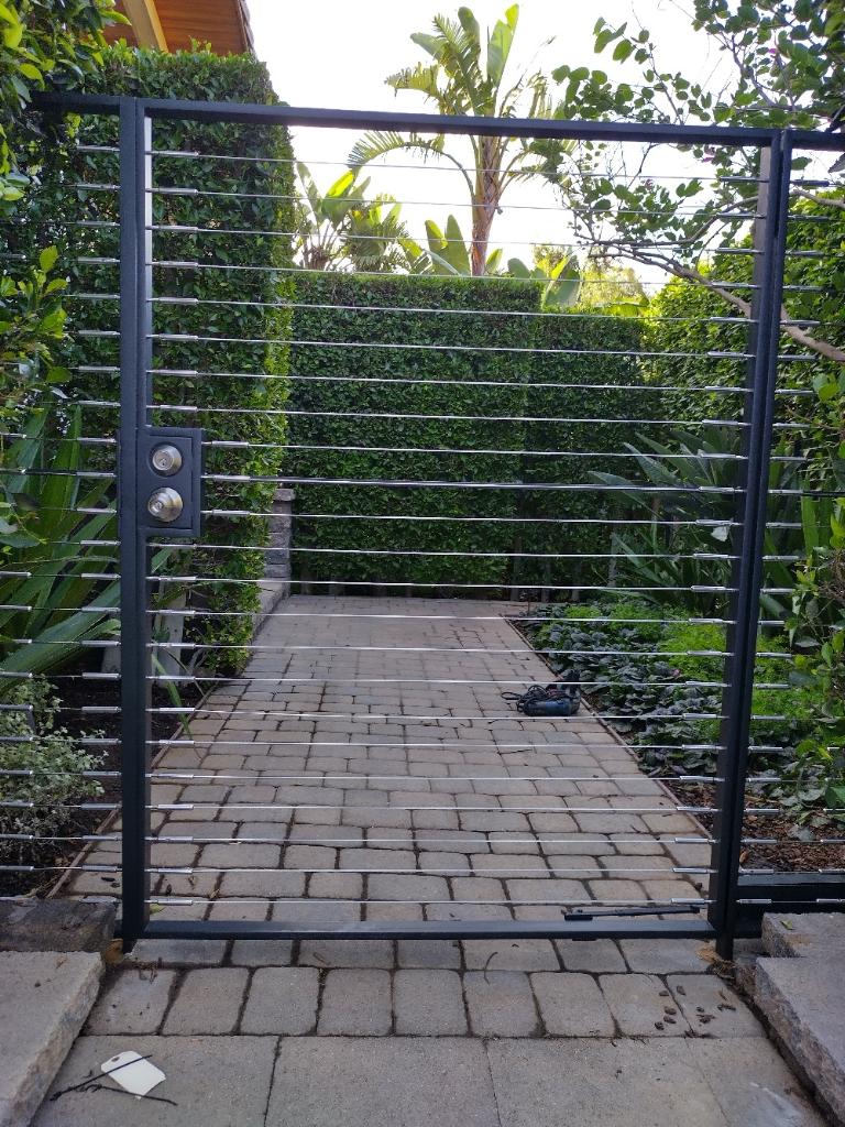 Custom-made pedestrian gate with horizontal cables