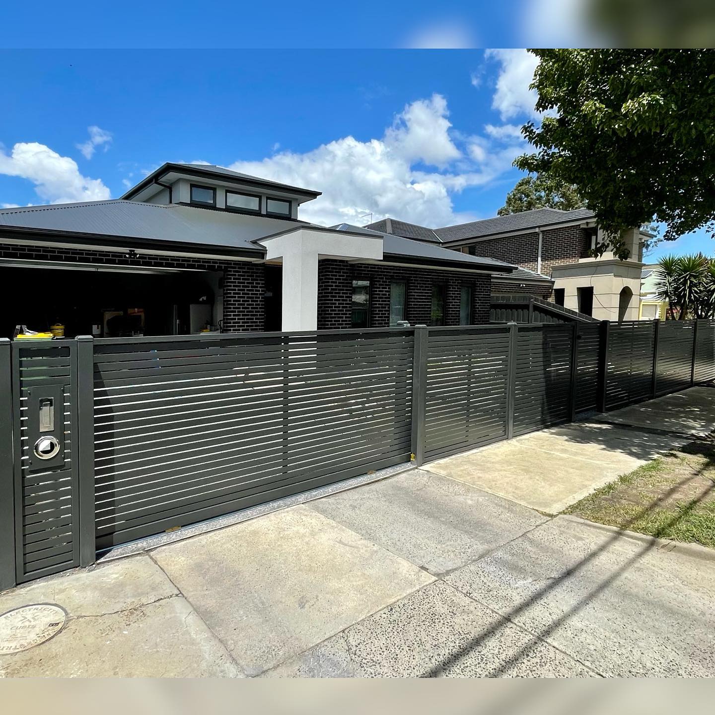Modern Screen Fence Installation in Preston Featuring the D5 Smart Gate Motor 5 Newly installed screen fence spanning front of suburban property